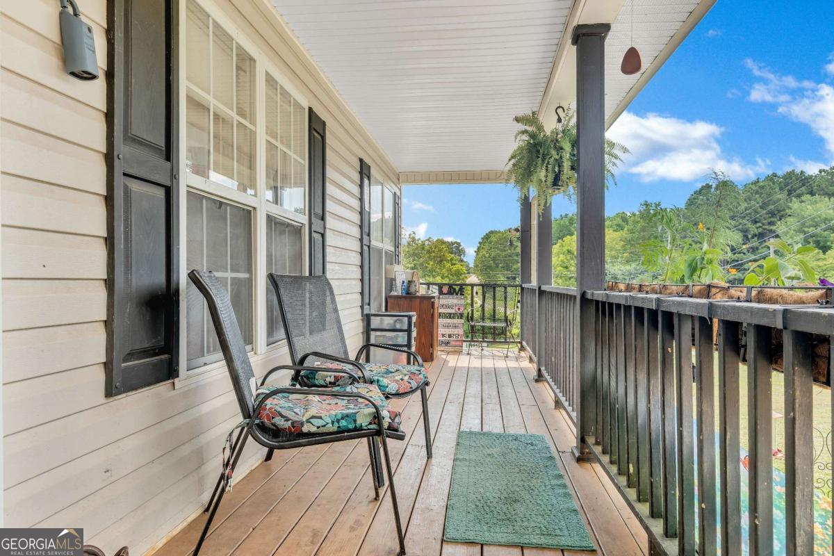 This charming 4-bedroom, 2-bathroom ranch offers 1,750 square feet of comfortable living space on a generous .73-acre lot, featuring a spacious front and backyard, a welcoming covered front porch, and a back deck perfect for outdoor enjoyment. Inside, the living room boasts hardwood-style flooring, tall ceilings, and a cozy fireplace, while the kitchen showcases warm stained cabinets, a pantry, and a bright eating area. The large master bedroom on the main level is filled with natural light from two walls of windows and is complemented by two nearby bedrooms and two full baths. Adding extra flexibility, the converted garage has been transformed into a private-entry studio apartment complete with its own bedroom and living area-ideal for guests, rental income, or a home office. Located just minutes from downtown Jasper with convenient access to the interstate, this property blends space, comfort, and location in one attractive package. This property won't be available for long... schedule your showing today!!