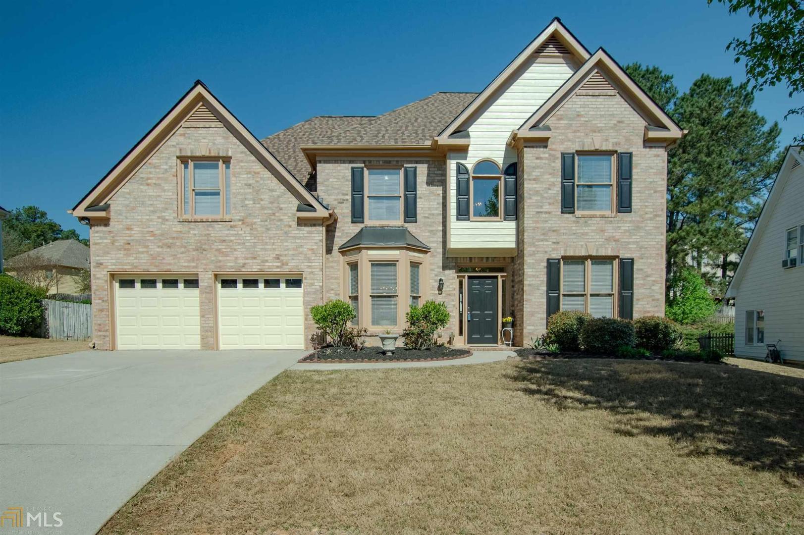 Stunning 5BR/3BA in Collins Hill/Chandler Pond Subdivision! Newly updated kitchen, hardwoods, bedroom on main level with full bath. Large Master Suite w/ Sitting Area/Office. Freshly painted inside & out, new roof, new Garage Doors, New Palladium windows, All stainless appliances are included plus refrigerator. Washer and Dryer to stay as well. Backyard property line is about 10ft beyond the Evergreen bushes. Swim/Tennis Community and Lake to enjoy!