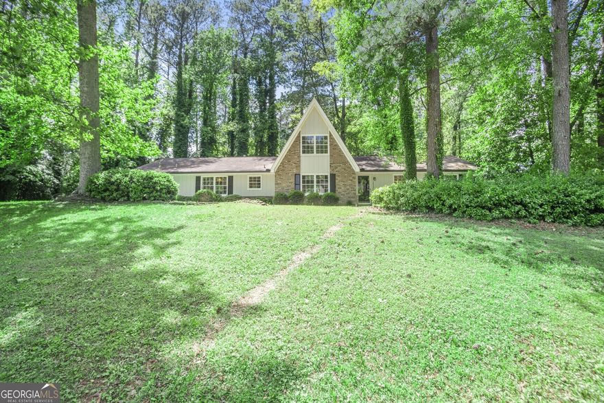 Tucked away on a spacious corner lot in highly sought after East Cobb; this Charming remodeled A-Frame home feels Like a Cozy Ski Lodge! Beautifully updated with 3-bedrooms, and two full baths this charmer blends rustic charm with modern comfort, and the ease of one level living. From the moment you step inside, you'll be greeted by soaring high ceilings, fresh neutral paint, and new flooring throughout, creating an open, airy feel that evokes a warm mountain retreat. The remodeled interior features quartz countertops in the kitchen and bathrooms, complemented by all-new lighting, faucets, and cabinet hardware. The kitchen also boasts a new microwave and dishwasher, perfect for everyday use and entertaining. The versatile upstairs loft can serve as a home office, creative studio, or even a fourth bedroom if needed. Major upgrades include two new HVAC systems, new water heater, and new gutters, offering peace of mind for years to come. The exterior has been freshly painted, giving the home fantastic curb appeal. Located in a top-rated school district and priced under $550,000, this home offers exceptional value in an unbeatable East Cobb location. Don't miss this move-in ready gem that perfectly combines lodge-like charm with modern updates! Welcome home!