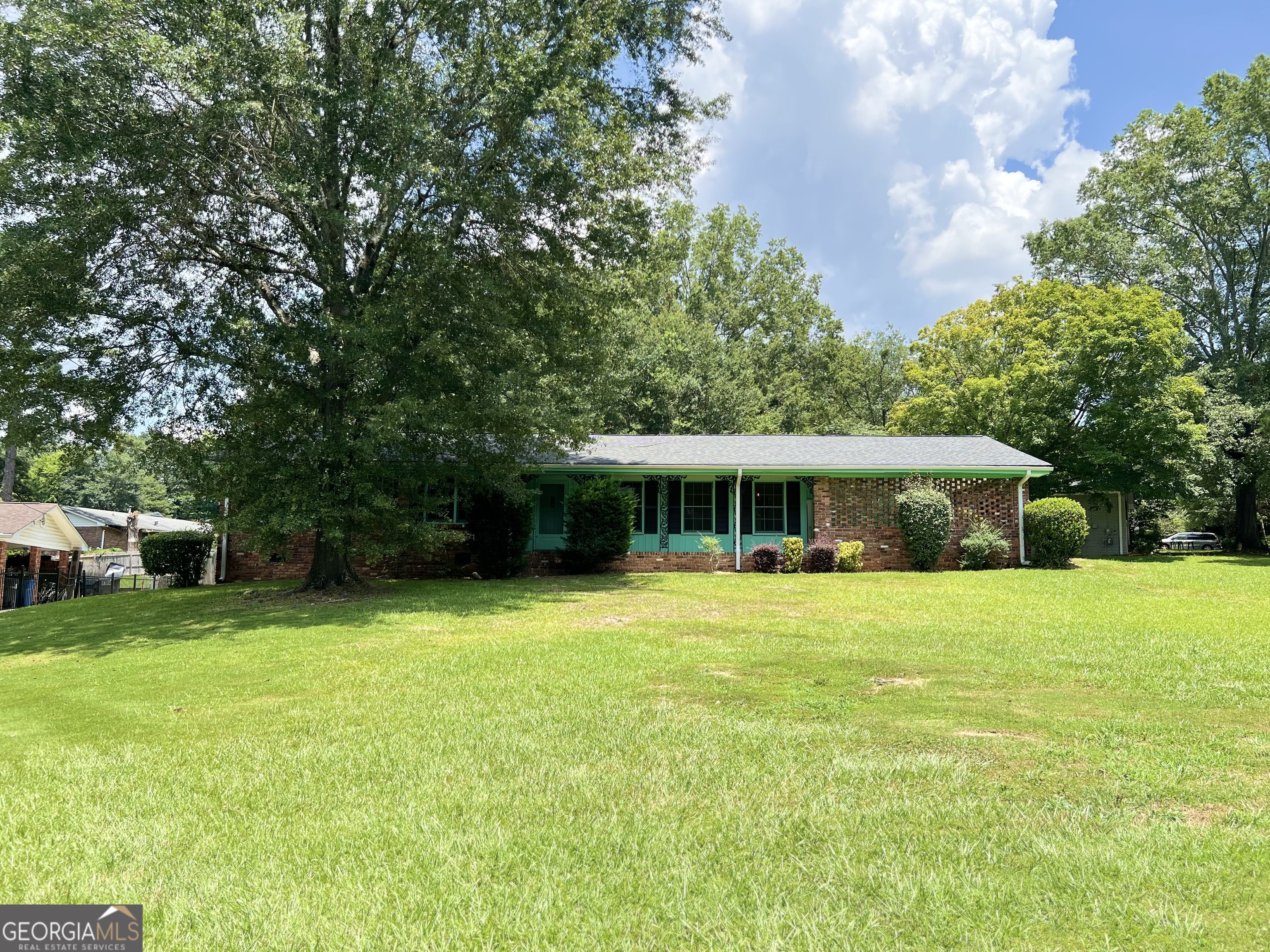 A sweet little gem located in the heart of East Point! Completely put your own spin on it or keep it in its original RETRO state. This three-bedroom home, with two full baths, is located on over a half acre. Your new property has a two-car carport, as well as a two-car private garage out back. A spacious, flat backyard is perfect for gardens and gatherings, as well as a huge front yard to plant your rose bushes and hydrangeas. Welcome Home!