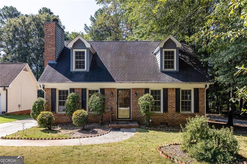 Welcome to 4357 Erskine Road, a charming Cape Cod bungalow nestled in the heart of vibrant Clarkston, GA! This cozy 3-bedroom, 2-bathroom residence, built in 1986, offers 1,400 sq ft of comfortable living space on a 0.2-acre lot, perfect for those seeking a blend of modern convenience and suburban tranquility. The property's prime location provides easy access (directly across the street!) to the PATH bike and pedestrian trail system, ideal for outdoor enthusiasts. You're just minutes from downtown Clarkston, Stone Mountain Park, and major highways I-285 and 78, offering a perfect balance of serene living and urban connectivity. Nearby cultural markets, restaurants, and Refuge Coffee Company add to the area's unique charm. Additional features include a 2 car detached garage, tankless water heater, and low annual taxes. This move-in-ready gem is perfect for first-time buyers, small families, or investors looking for a property in a diverse and welcoming community. Don't miss the opportunity to own a piece of Clarkston's charm!