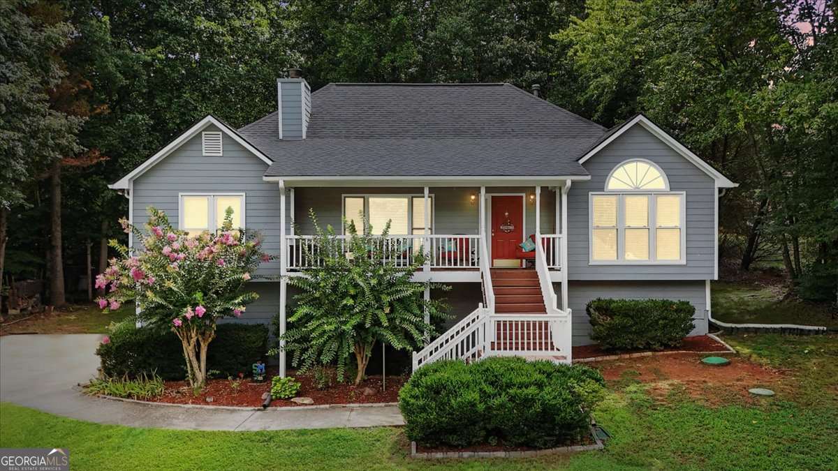 Discover this stunning 3-bedroom, 2-bath home tucked away in the sought-after Legacy Park community of Powder Springs. Offering the perfect balance of charm and modern updates, this home welcomes you with soaring vaulted ceilings in the family room, a cozy wood-burning fireplace with gas starter, custom built-in bookshelves, and beautiful LVP hardwood flooring. The spacious layout includes a separate dining room, a large master suite with 2 walk in closets, and a bright kitchen with tiled floors. Downstairs, you'll find a versatile drive-under basement featuring a finished bonus room/ possible 4th bedroom, a stubbed bath, and an oversized 3-car garage - ideal for storage, hobbies, or a workshop. Step into the screened-in porch to enjoy year-round comfort and take in serene views of deer, squirrels, and even the occasional fox, or entertain guests on the expansive deck. Recent upgrades provide peace of mind with new exterior paint (2023), a brand-new roof (2018), and new front windows. Best of all, this home sits in a quiet, well-established neighborhood with no HOA, giving you the freedom to truly make it your own while staying close to schools, parks, shopping, and dining. This is more than just a house - it's a forever home where comfort, care, and convenience come together.