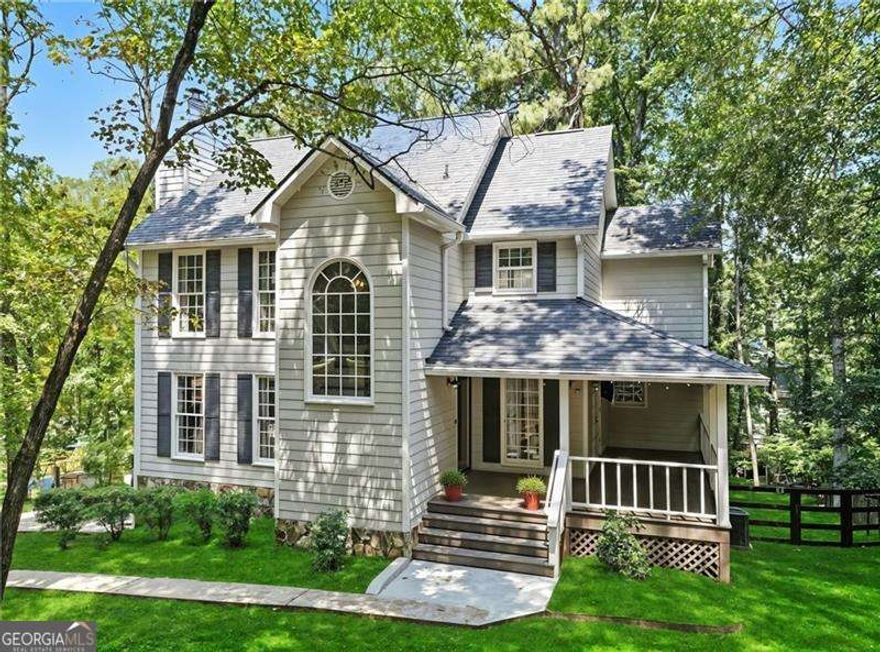 Location, Location, Location....This Beautifully updated 3 bedroom 2 1/2 bath home it situated on a tranquil private wooded .64-acre lot in the beautiful sought-after Swim/ Tennis / Lake community of Crabapple Falls. This meticulously maintained home is move in ready!!! The cozy front porch offers beautiful curb appeal in addition to spacious outdoor living space. The main floor offers spacious Kitchen, Family & Dining Rooms perfect for entertaining. The luxurious 2nd floor owner's suite features vaulted ceilings and walk-in closet. The 2 car drive under garage has a ton of extra space for a game room, workshop, ATV storage, motorcycles, jet skis, etc. Take time to relax out on the oversized deck that is perfect for grilling out, enjoying your morning coffee, or gathering with family and friends. This gem of a home's location offers easy access to Downtown Woodstock, Milton, Alpharetta, Roswell and Canton. Enjoy the benefit of low Cherokee County taxes as well as excellent award-winning schools.