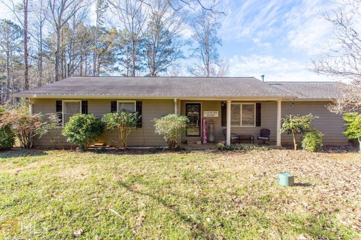 An adorable, personality plus RANCH home on 4 ACRES in North Paulding District? Better hurry!  This one won't last long! Enter into the hardwood foyer, with a view of the dining area, the family room, the sunroom & the kitchen! The large island is perfect for entertaining. This home has two springs on it, & a beautiful pond! The bedrooms & bathrooms are well updated! There are so many great aspects of this home, from the wood burning stove in the mud room, to the porch swing in the family room, to the whole house fan! Live in total privacy, but convenient to everything!