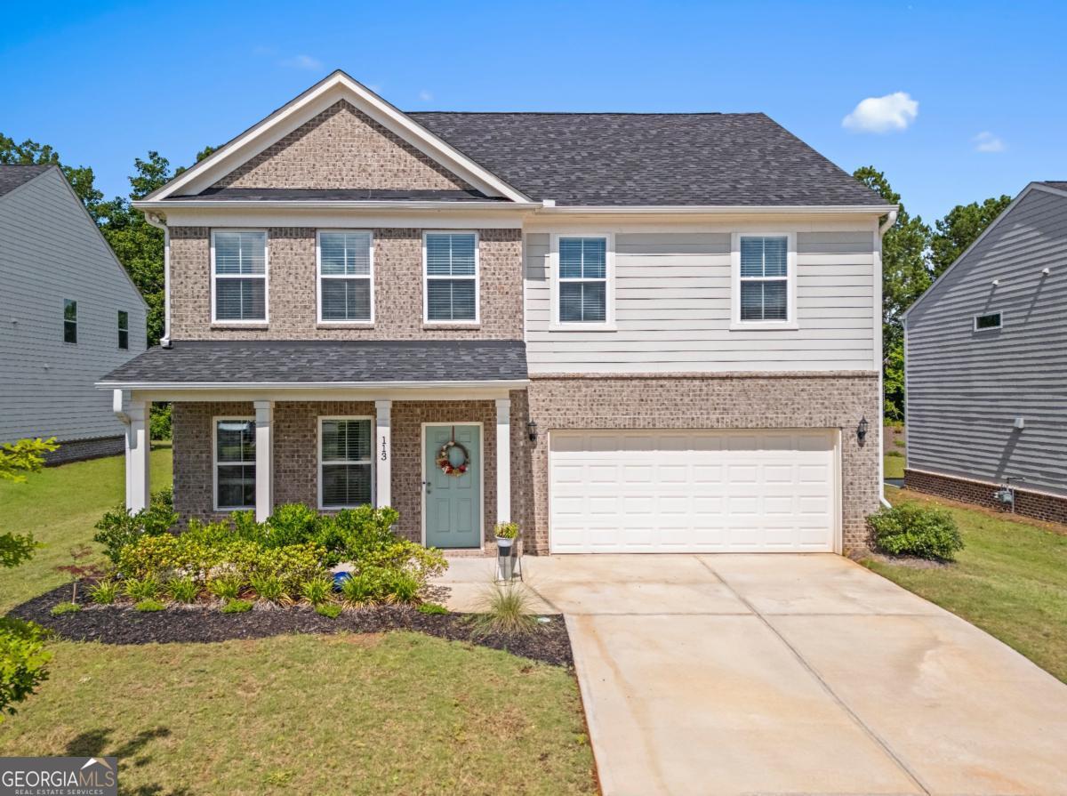 This gorgeous 2,676 square feet, 4 bedroom, 2.5 bath home is only 2-years old, has been METICULOUSLY maintained, BEAUTIFULLY upgraded throughout, and is completely TURN KEY. Step inside and you'll be welcomed by a generously-sized foyer. To the left is a separate office with glass doors and a large picture window that over looks the front yard and lets in plenty of light. The open concept living/dining space is perfect for entertaining and offers a spacious kitchen that boasts quartz countertops, contemporary tile backsplash, a large island, stainless steel appliances, and a built-in storage cabinet with seating (added by the homeowner). Every design upgrade in this home was thoughtfully and carefully considered to maximize its beauty and customization-starting with the striking wood slate feature that masterfully accentuates the family rooms' 9' ceiling height. The porcelain accent wall frames the wall-mounted television beautifully and serves as a stunning, eye-catching focal point. Just off the family room is a bonus/flex space that can easily be used as a gym, playroom, or sitting area. The half bath and 2-car garage round out the main floor. Upstairs, you are welcomed by a fabulous loft space, a laundry room with additional cabinetry added by the homeowner, 3 spacious secondary bedrooms, a hall bathroom with dual vanity, and a GORGEOUS master bedroom retreat, with ensuite and walk-in closet, was designed with peace, comfort, and relaxation in mind. It is the perfect space to unwind after a long workday or after spending time with family in the completely leveled, fenced-in backyard. This show stopping home, located in the highly desired neighborhood of Hawthorne Ridge by Pulte Homes, is situated DIRECTLY ACROSS THE STREET from the gorgeous community clubhouse, large pool, and gazebo. A well planned, family oriented neighborhood that even features a dog park for the fur babies to enjoy--all within 5-10 minute access to shopping, dining, and I-75. Come see ALL that this home has to offer and make it YOURS today!