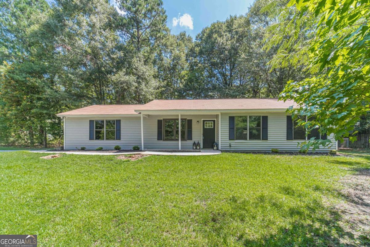 Fully Renovated 3-Bedroom Ranch on Over 1 Acre in Loganville School District - No HOA! This beautifully renovated 3-bedroom, 2-bathroom ranch is nestled on a private, level lot just over 1 acre in the highly sought-after Loganville School District. With no HOA and a secluded setting, this home offers both privacy and peace of mind. Step inside to find brand new luxury vinyl plank flooring throughout, an all-new kitchen featuring stainless steel appliances, granite countertops, and a classic subway tile backsplash. Both bathrooms have been stylishly upgraded, and all light fixtures have been replaced with modern, energy-efficient options. Major systems have been recently updated-roof and HVAC are less than two years old, and the garage door and opener are brand new. Enjoy the outdoors in your fully fenced backyard, perfect for entertaining, pets, or play. This move-in ready gem combines modern upgrades with space, privacy, and top-tier schools-don't miss out!