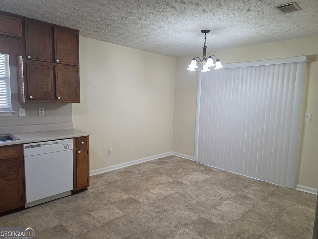 Photo of 5852 Summerglen Lane, Atlanta, GA 30349 (MLS # 10876825)