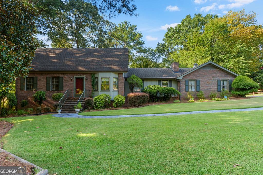 This well maintained home is located in an excellent subdivision in Riverdale with a beautifully landscaped and mature yard. This solid, brick home features a formal living room, dining room, den with fireplace w/gas starter and logs, kitchen with eating area and master bedroom/bath on the main level. Upstairs has 3 bedrooms, a full bath, and a walk in closet with entrance to the attic storage area. There is a full basement with some finished rooms and others that can be finished, a sliding glass door and exterior entrance door. This is a well built, solid home that is ready for your personal touches to make this property your own.