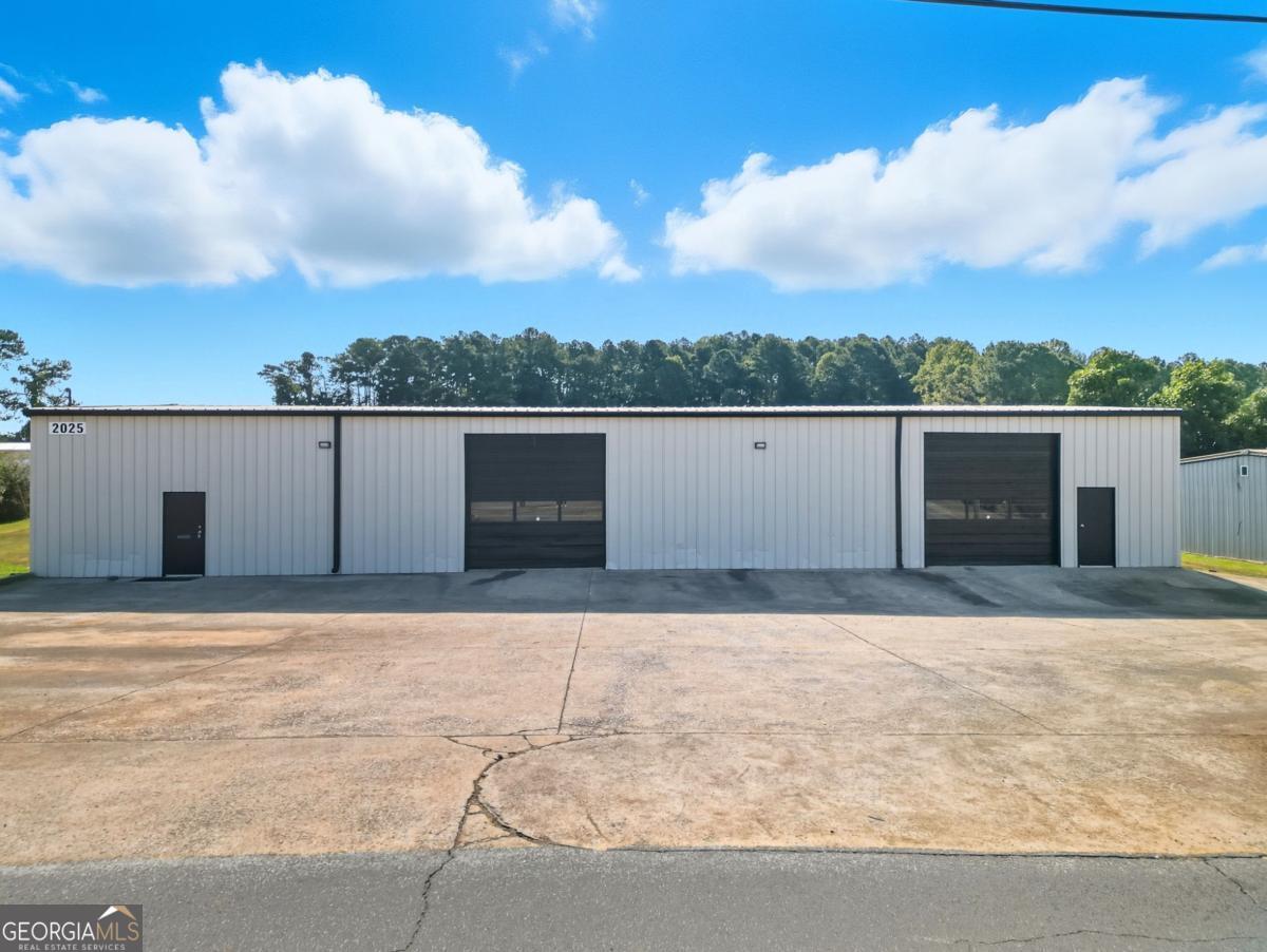 Available for purchase, this well-maintained 5,000 SF industrial warehouse offers an ideal opportunity for owner-users or investors seeking a flexible facility in a convenient Dallas, GA location. Building Layout: 1,000 SF of finished office space, 4,000 SF of functional warehouse space, plus an additional 800 SF mezzanine above the office for extra storage. Office Features: Three private offices, reception area, and two restrooms. Recently upgraded with fresh paint, new LED recessed lighting, and a brand-new HVAC system. Warehouse Features: Two large roll-up bay doors, new LED lighting, utility sink, and heater for year-round use. Exterior Improvements: Freshly painted facade, upgraded exterior lighting, and ample front parking for staff and visitors. Power: Equipped with 3-phase power to meet industrial and manufacturing demands. With its move-in ready condition, modern upgrades, and functional layout, this property is an excellent fit for businesses in need of both office and warehouse space, or for investors seeking a high-demand industrial asset in the growing Dallas, GA market.