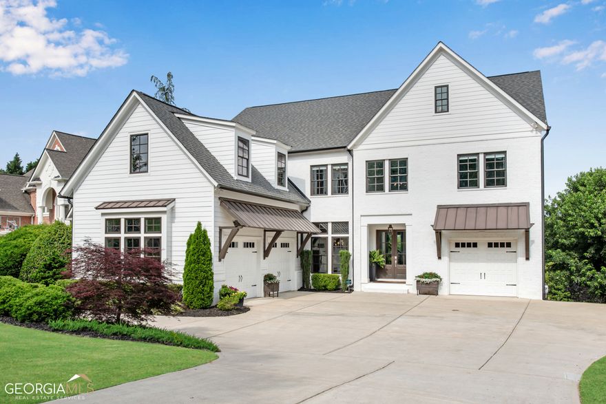 STUNNING aLIKE NEWa CUSTOM HOME built in 2019 in sought after DENMARK HIGH SCHOOL district! This MODERN STYLE FARMHOUSE is well-appointed and resplendent in beautiful moldings & architectural details. Beautiful french doors welcome you into a 2-story foyer providing the first glimpse of the luxurious features throughout this home. The FAMILY ROOM has a stunning wall of windows, working fireplace with CUSTOM TILE SURROUND, WOOD BEAMS, custom cabinets & FLOATING SHELVES. The CHEF'S KITCHEN boasts quartz counters, FARM HOUSE SINK, BUILT-IN REFRIGERATOR, GAS RANGE, double ovens, microwave, BEVERAGE CENTER, walk-in pantry, a FABULOUS ISLAND and separate breakfast room. STACKING NANO DOORS open to the COVERED REAR PORCH which is the perfect spot to sit by the fire and enjoy the private back yard. Donat miss the guest bedroom with en-suite bathroom, the office and a SEPARATE POWDER BATH that complete the main floor. The MASTER SUITE offers a double tray ceiling, SPA STYLE BATHROOM with SOAKING TUB, a CUSTOM CLOSET, reading nook and easy access storage area. The upstairs secondary bedrooms are HUGE and all have en-suite bathrooms & large closets. Wait! There is more! A FINISHED TERRACE LEVEL offers a CUSTOM BAR, family room, BEDROOM, FULL BATH, media room, pool table area & more! The private back yard is very deep - check out the aerial view a and ready for a pool!! Did I mention the house is WIRED FOR SPEAKERS in several locations, has 10 FOOT CEILINGS & 8 FOOT DOORS on the main floor and in the basement, has a HOT TUB that stays, a 4th GARAGE located in the terrace level for extra storage & an EXTRA PARKING PAD - perfect for a family with teenagers! Stoney Point Farms is a GATED, Swim/Tennis Community that is 3 miles from Halcyon, 7 miles from Avalon/Downtown Alpharetta and only 4 miles from The Gathering a Forsyth Countyas future sports arena, shopping, dining & entertainment complex!