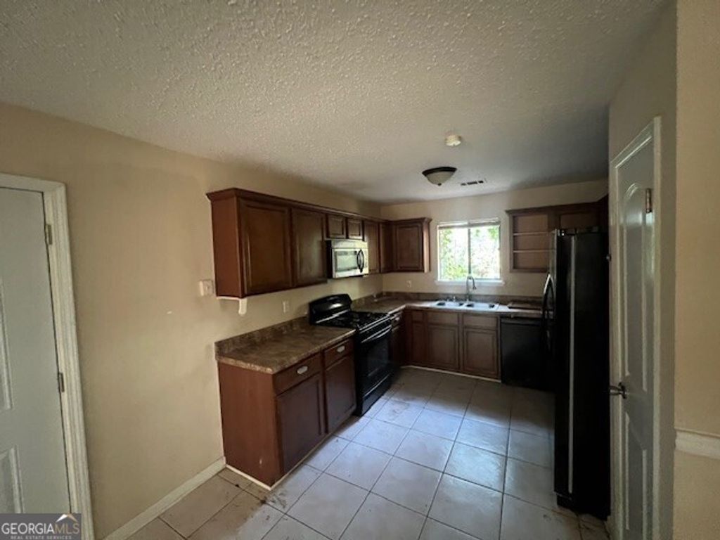 Photo of 1027 Mainstreet Lake Drive, Stone Mountain, GA 30088 (MLS # 10631189)
