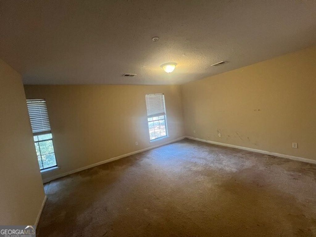 Photo of 1027 Mainstreet Lake Drive, Stone Mountain, GA 30088 (MLS # 10631189)