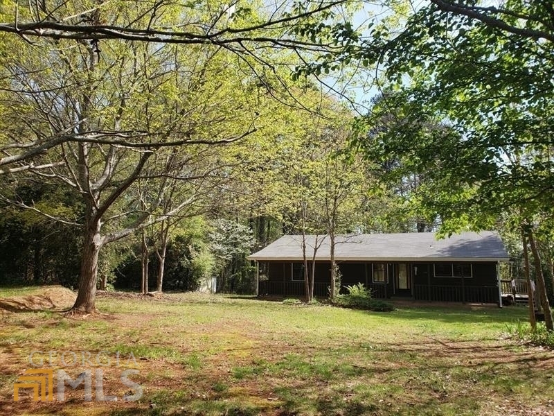 " 0% OWNER FINANCING WITH PAYMENT OF 30% DOWN PAYMENT" CALLING ALL BUILDERS, DEVELOPERS, AND INVESTOR: ESTATE SIZED LOT IN SNELLVILLE: DON'T MISS. THIS IS ONE OF A KIND OPPORTUNITY FOR OVER 2.81 ACRES RESIDENTIAL LOT IN SNELLVILLE. HOME IS LIVABLE BUT IS NOT CONSIDERED IN VALUE OF THE LISTING PRICE. WE ANTICIPATE A CUSTOM LUXURY BUILDER WILL PROVIDE A NEW CONSTRUCTION HOME OR HOA IN PLACE OF THE HOME CURRENTLY AT THE SITE. NO HOA CONTROLS. MANY HOMES IN THE AREA ARE BEING REPLACED WITH LARGER LUXURY HOMES OR NEXT HOA WITH TOWN-HOMES PRICING UP TO 400K FOR EACH UNIT. PURCHASE THIS BEAUTIFUL LOT AND START BUILDING YOUR OWN HOA OR YOUR CUSTOM BUILDING. AWARD WINNING BROOKWOOD HIGH SCHOOL DISTRICT 4 BEDS AND 2 BATHS WITH LARGE SUN-ROOM. WALKING DISTANCE FROM HIGHWAY 78 AND SHOPS. LAND SURVEY AVAILABLE.