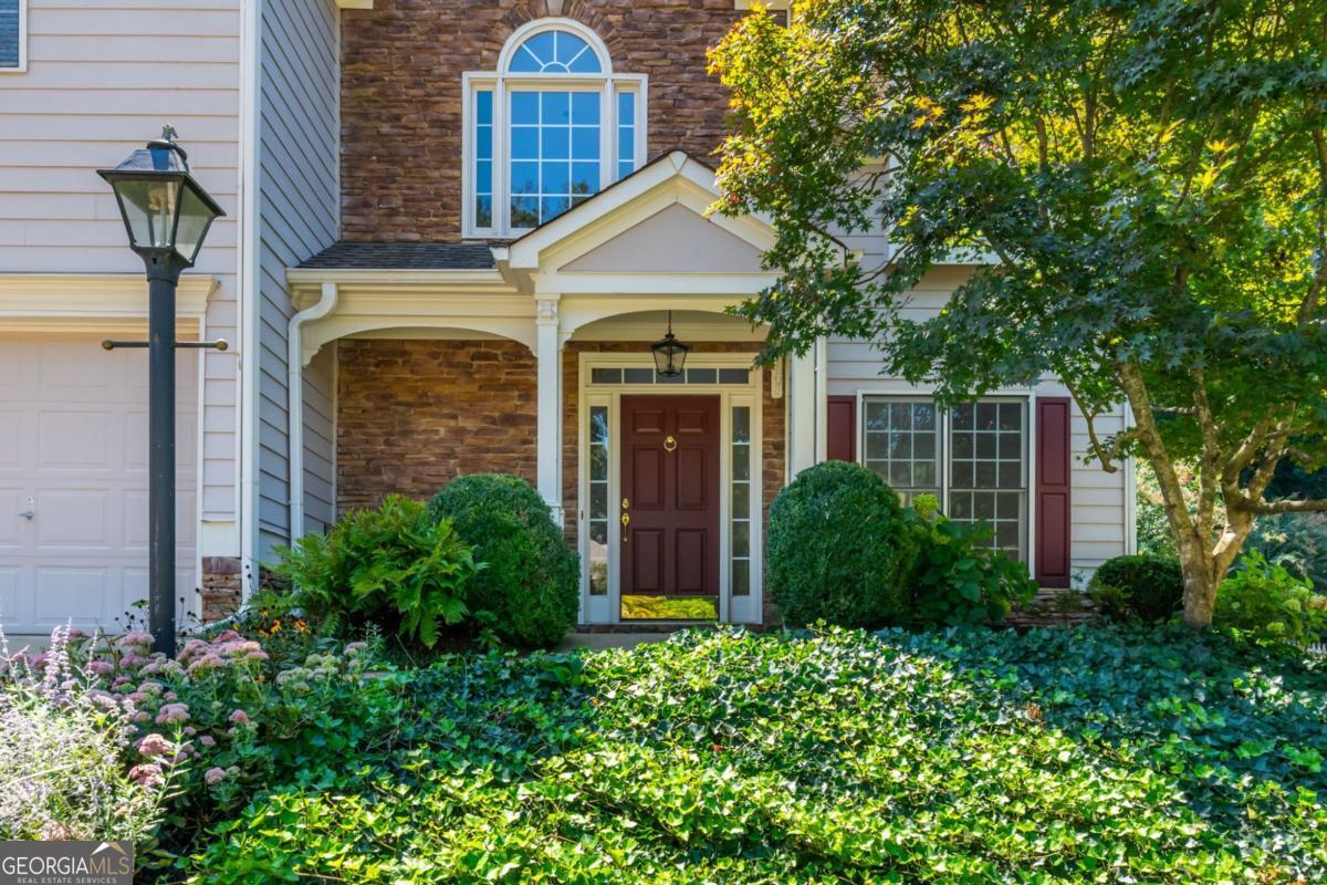 Welcome Home! Don't miss this original owner home in the fabulous Deer Run Subdivision! Fresh Interior Paint throughout along with all new Carpet and new LVP Flooring in Primary Bath. Enter into this spacious, light filled home with Hardwoods in 2 story Foyer and Kitchen, Beautiful Archways, Built Ins in Family Room and Secondary Bedroom, Large Closets and more. Enjoy many entertainment spaces with Kitchen open to Family Room and then Dining and Living Room combo as well as the walk out Patio off Kitchen. Once in the Backyard, enjoy the serene professionally landscaped space with privacy and arbors on either side of the home. The front welcomes you with so much curb appeal and manicured landscaping that is kept looking great with irrigation system that is on it's own separate water line. Kitchen has great sized Pantry, so much Counter Space, Stainless Fridge that remains with the home and a view to Family Room and Backyard. Upstairs there are 4 generous sized Bedrooms, including Primary with 2 Walk In Closets, a Bump Out Sitting Area, Tray Ceiling, Two Vanities, Separate Shower and Tub and private water closet. Also upstairs is a Guest Bath with separate sink and toilet/tub/shower area and large Laundry Room. Close to Interstate, Downtown Woodstock, Shopping, Schools, Restaurants and more! Amazing amenities in the Sought After Deer Run Subdivision including Pool, Tennis Courts, Pickle Ball Courts, Clubhouse, Basketball Court, Playground and more!
