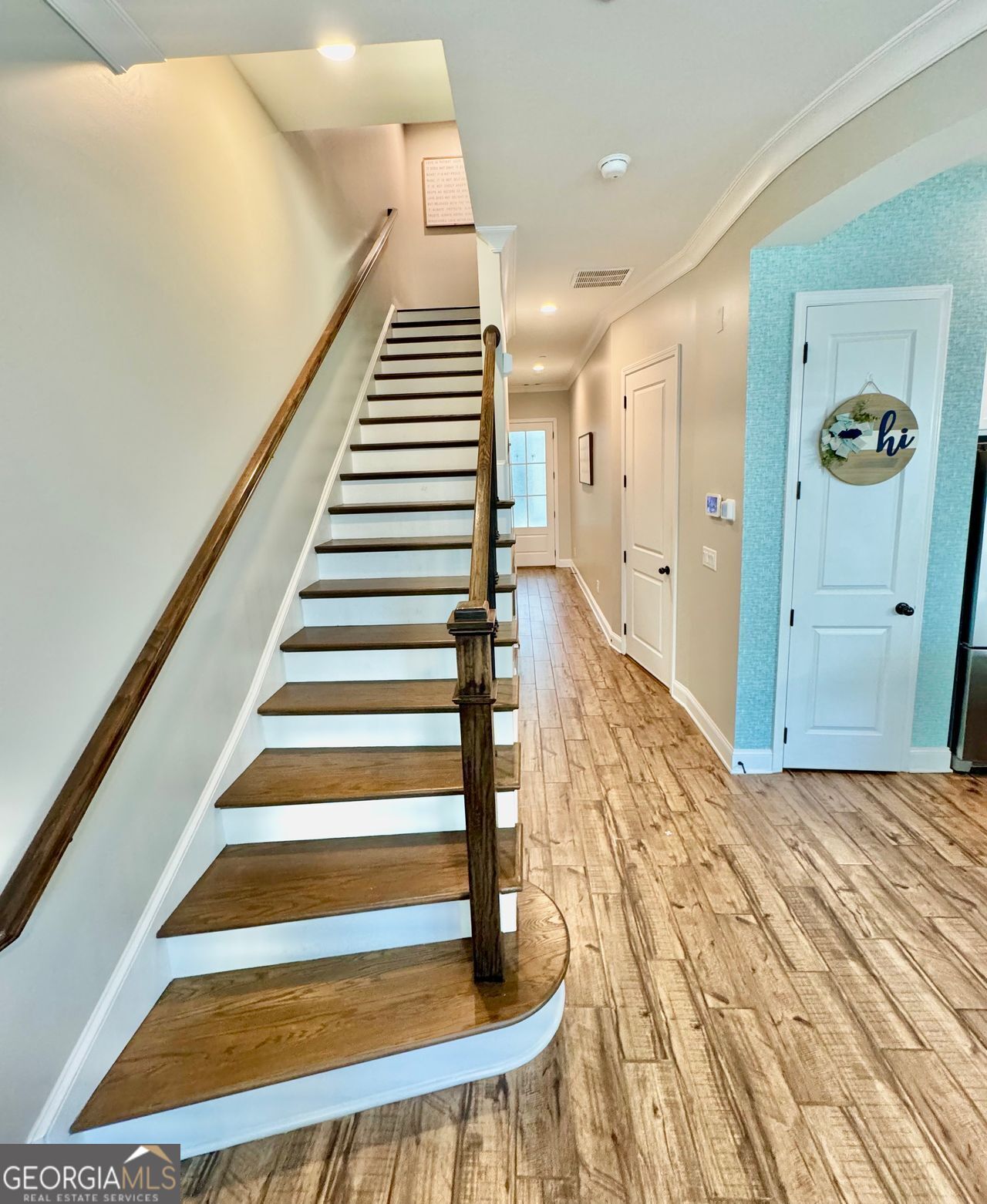 The LOCATION of 204 Dellwood cannot be beat. This property resides inside the gates of The Village of Belmont community. This community is one block away to downtown Smyrna where you can walk to the amazing restaurants, city celebrations, Smyrna library, community center, the new Brewery being built, and multiple parks and outdoor spaces. This community is one of the most sought-after lifestyles in SMYRNA. The village of Belmont hosts food trucks from spring to fall and hosts many social events for residents. With two saltwater pools, two cabanas, ample green space, a turfed dog park, and nine pedestrian gates, this is a community to enjoy. Whether you enjoy a cookoff contest or pool party, this is a great place to meet new friends or enjoy your beautiful personal space. 204 DELLWOOD is a prime example of craftsmanship and luxury. This home is in great condition with custom touches of luxury, convenience, modernization, entertainment and functionality. The home is wired throughout for security, surround sound, smart features of which many can be controlled my your own phone. The natural light flowing through the home is one of it's best features as it highlights the tall ceilings, clean lines, gorgeous flooring, and designer touches. Upon heading up to the second floor you are met with 3 bedrooms and two full baths. One of these bedrooms is the oasis of the owner's suite. Once you walk through the doors of the oversized room, you immediately feel relaxed. Then you slide the barn door open and walk into the large bathroom with double sinks, toilet closet, spa tub, and entry into the massive walk-in closet. Upon exiting back out of the suite, you will pass the conveniently placed laundry room before heading to the 3rd floor getaway. The third floor boasts a large open entertainment space to be used as a playroom, media room, or even an office. Add in the 4th bedroom, the full bath and the wet bar (complete with a drink fridge and sink) and you have a separate upstairs getaway. The final highlight of the home is stepping out on your own brick patio large enough to entertain, that is complete with puppy-potty- proof area, hardware for lights, and your own built in brick complete with a natural gas line connected (no more buying and lugging around propane tanks!) Come and experience the lifestyle of 204 Dellwood Dr and the Village of Belmont.