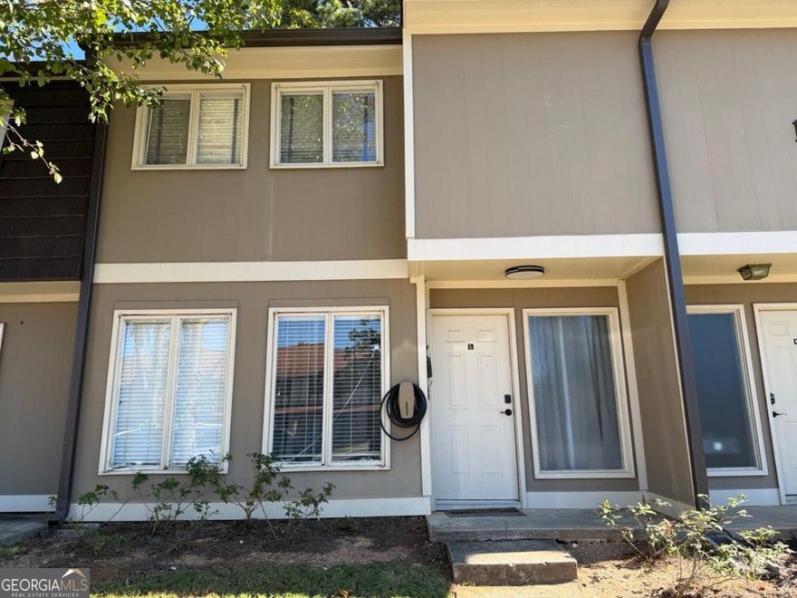 This lovely townhome boasts two spacious bedrooms and two full bathrooms, each designed with a master suite feel to ensure comfort and privacy. The convenience this location offers is hard to beat. Located just minutes away from The Battery, Cumberland, and the heart of Marietta, you will have access to a variety of recreational activities. From shopping and dining to attending exciting events, there's something for everyone. Proximity to Life University offers a unique opportunity for lifelong learning and community engagement, perfect for all ages.  HOA Pays for everything except power and internet.  Unlimited water, hot water, Gas, Sewer, household trash; all exterior maintenance including lawn, pool, and outdoor amenities.  HOA's responsible for roof and all exterior maintenance and exterior pest control.  This townhome was owned by Life University for over 20 years with all maintenance taken care of and is currently owned by a single couple with no children, taken well care of and numerous upgrades have been performed during their time owning the townhome.  Upgrades Include:  Genuine Tesla EV Charger (11KW).  New recessed motion smart dimmable lighting in all areas.  New modern ceiling fans (three with remote & one with Wi-Fi app control)  New modern chandelier in Dining room (motion)  New modern kitchen motion dimmable light  Networking space in closet for internet and Cat5 installed to living room and bedroom  Textured ceiling removal in living room.  Google Nest Thermostat Gen4 with upstairs Temp sensor  Aquira G4 Video Doorbell (Apple HomeKit Compatible)  Yale Smart Deadbolt (Apple Pay NFC & auto Bluetooth unlock & HomeKit compatible)  Wyze Camera Floodlight in rear  Washer and Dryer included in sale  3 TV mounts included in sale.