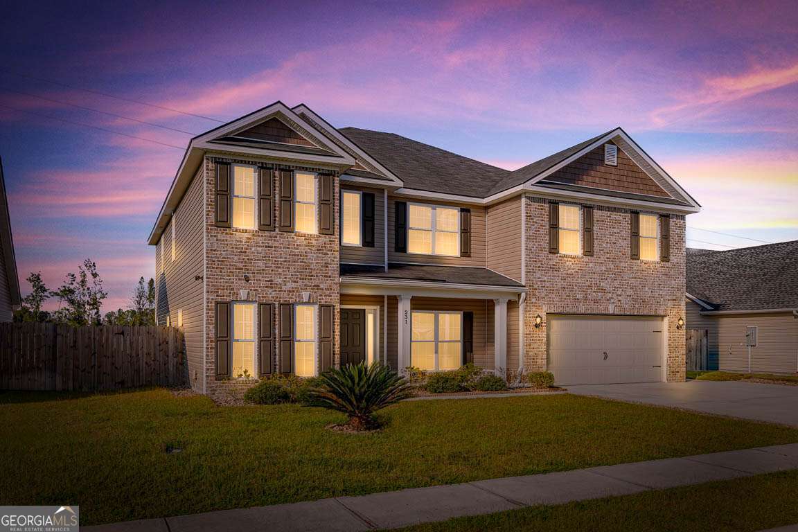 Welcome to this stunning 4,352 sq ft brick home offering 5 bedrooms and 3.5 baths, all nestled behind a fully fenced backyard for added privacy. Stylish LVP flooring flows through the main living areas, leading you to the heart of the home-a gourmet kitchen with granite countertops, gas cooktop, double ovens, a spacious island, breakfast bar, breakfast area, stainless steel appliances, and a walk-in pantry. The first floor features a formal dining room and a main-level bedroom with an ensuite bath featuring a single vanity and marble-topped shower provides a convenient retreat. A beautiful split staircase rises to a generous second-floor flex space. The luxurious primary suite boasts plush carpet, a large sitting area, and two massive walk-in closets, along with a spa-like ensuite offering dual vanities, a garden tub, and a separate tiled shower. Three additional guest bedrooms and the laundry room complete the upstairs. There is plenty of storage space in a walk-in attic. Outside, enjoy a covered back porch, a two-car garage, and plenty of space to relax or play.
