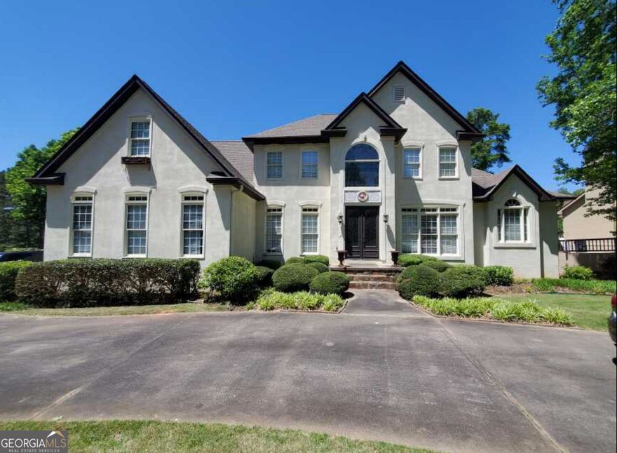 Unlock the full potential of this expansive 6,300+ sq ft of finished living space property in Newnan's prestigious White Oak community-an established golf course neighborhood just minutes from I-85, Piedmont Newnan Hospital, and the thriving Ashley Park shopping and dining district.    This 5-bedroom, 4.5-bathroom home sits on a prime golf course lot and features a layout ideal for high-end resale or long-term hold. With a two-story foyer and great room, additional formal living and dining rooms, a master suite on the main level, and a full finished basement, the bones are solid-the vision is yours.    The property includes a 2.5 -car garage, eat-in kitchen, and ample entertainment space, all overlooking the scenic fairways of the White Oak Golf Course. Renovation is needed throughout, presenting the perfect canvas for investors looking to capitalize on square footage, location, and lifestyle appeal.    Situated in one of Coweta County's most desirable communities, this home is a short golf cart ride to White Oak's clubhouse, pool, and tennis amenities. Downtown Newnan's historic charm and fine dining are just 10 minutes away, with Hartsfield-Jackson Airport a convenient 30-minute drive.    This is a rare chance to reimagine a luxury property in an area where renovated homes command top dollar. Cash or renovation loan buyers only-serious investors, bring your vision and crew. As-is