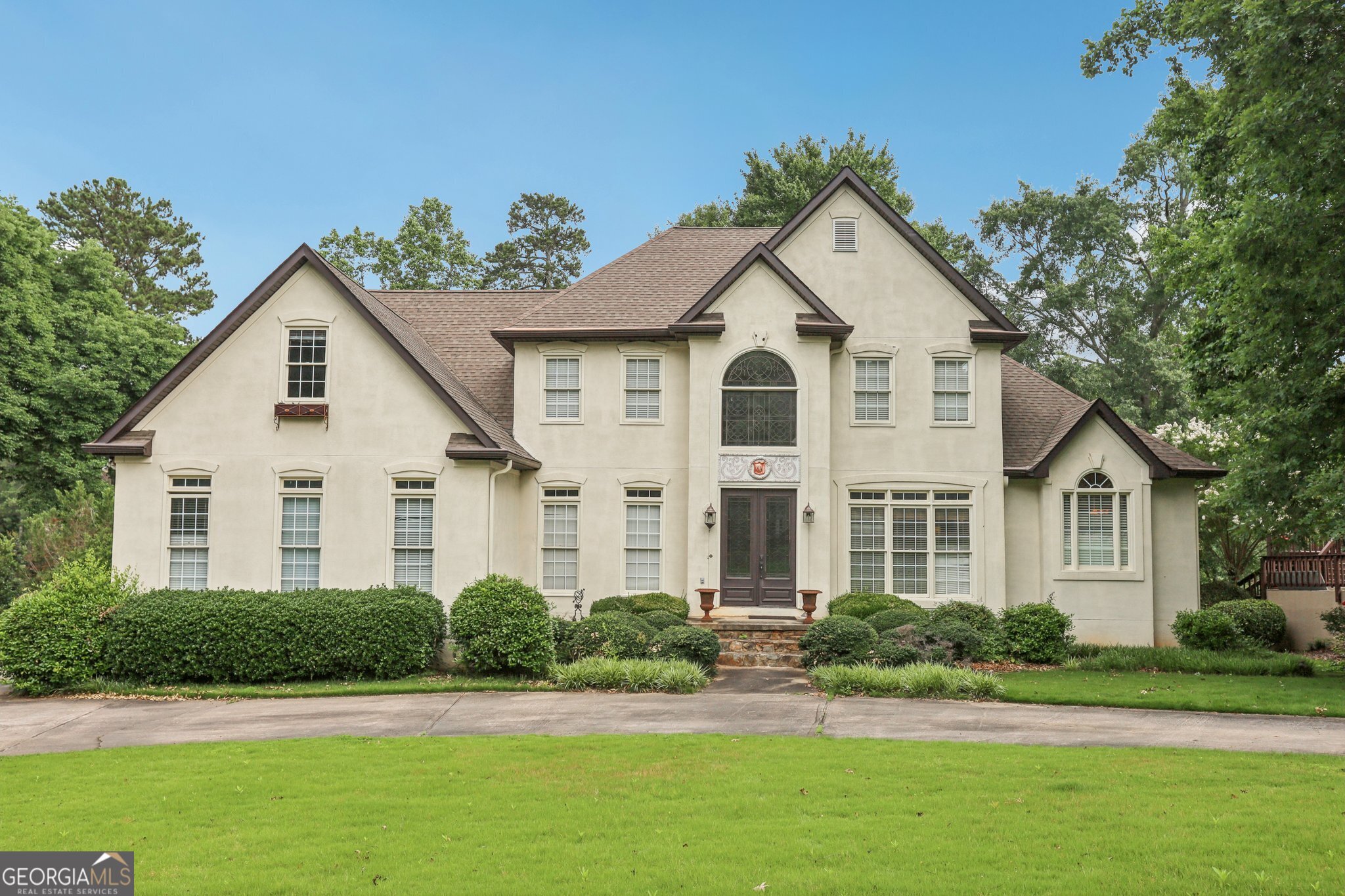 Unlock the full potential of this expansive 6,300+ sq ft of finished living space property in Newnan's prestigious White Oak community-an established golf course neighborhood just minutes from I-85, Piedmont Newnan Hospital, and the thriving Ashley Park shopping and dining district. This 5-bedroom, 4.5-bathroom home sits on a prime golf course lot and features a layout ideal for high-end resale or long-term hold. With a two-story foyer and great room, additional formal living and dining rooms, a master suite on the main level, and a full finished basement, the bones are solid-the vision is yours. The property includes a 2.5 -car garage, eat-in kitchen, and ample entertainment space, all overlooking the scenic fairways of the White Oak Golf Course. Renovation is needed throughout, presenting the perfect canvas for investors looking to capitalize on square footage, location, and lifestyle appeal. Situated in one of Coweta County's most desirable communities, this home is a short golf cart ride to White Oak's clubhouse, pool, and tennis amenities. Downtown Newnan's historic charm and fine dining are just 10 minutes away, with Hartsfield-Jackson Airport a convenient 30-minute drive. This is a rare chance to reimagine a luxury property in an area where renovated homes command top dollar. Cash or renovation loan buyers only-serious investors, bring your vision and crew. As-is