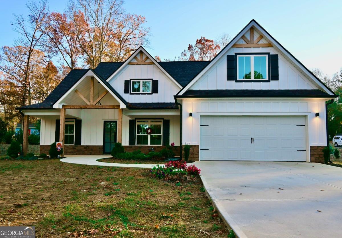 Custom-built modern farm-house located in Tyrone, GA, just 20 minutes from Hartsfield-Jackson airport, built on a private one-acre lot with mature trees. Low maintenance exterior with hardiplank siding/board and batten, cultured stone knee wall, and vinyl soffits/porch and patio ceilings. Custom iron front door, 100% LED owner-selected black light fixtures, and extra foundation, window, and door insulation, all contribute to very low monthly power bills, even in the warmest and coldest months. Luxury vinyl plank flooring in all rooms, white shaker kitchen/bath cabinets with grey quartz countertops, matching Kitchen Aid black stainless steel appliances, and custom black plumbing fixtures throughout. Expanded, covered back patio is perfect for entertaining with extra lighting, ceiling fan, fireplace, and views of nature and area wildlife. Upper level has an expansive suite/multi-purpose room with ensuite bath and unfinished attic has the height and square footage for potential living space/additional bedrooms. Priced below most recent appraisal value, with planned new like-construction on adjoining lot and $1M+ plus existing and upcoming home communities within 2 miles. Just a short drive to Town of Tyrone parks/shopping or a few miles to Peachtree City restaurants, etc. Sought-after Fayette County schools!