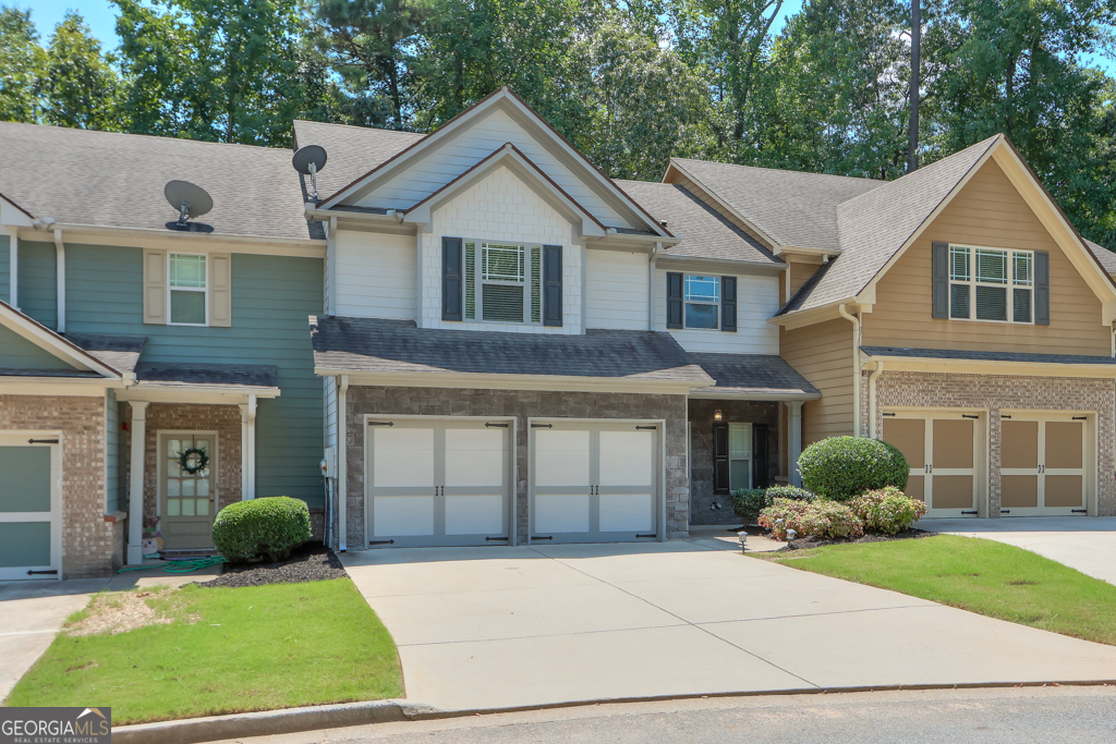 Move-in ready townhome in Brownstone Square - a GATED community a couple of miles from historic downtown Marietta. The entrance foyer leads to a powder room on the right and there are beautiful, new LVP floors flowing from the foyer into the cozy, fireside family room. This OPEN CONCEPT main level has a gourmet kitchen with tons of cabinets and counter space which overlooks the family room and separate dining room. Access your back patio from the dining room which overlooks a peaceful, wooded area. Upstairs features the oversized master bedroom with vaulted ceilings, hardwood floors, and an UPDATED bathroom offering a soaking tub, separate shower, and upgraded ceramic tile floors. There's also an enormous, walk-in closet with custom shelves and drawers. Two generously-sized bedrooms are also upstairs that share a full bathroom. And the laundry room is conveniently located on the upper level. Some additional upgrades include fresh/neutral interior paint & updated lighting, and there's NO CARPET! This is an active community with a pool and the HOA takes care of the lawn & the home exterior. You can't beat the location - 2 miles from the Marietta Square and only 8 miles from the Braves Stadium - and conveniently located near the interstate for an easy commute. Honestly a rare find!