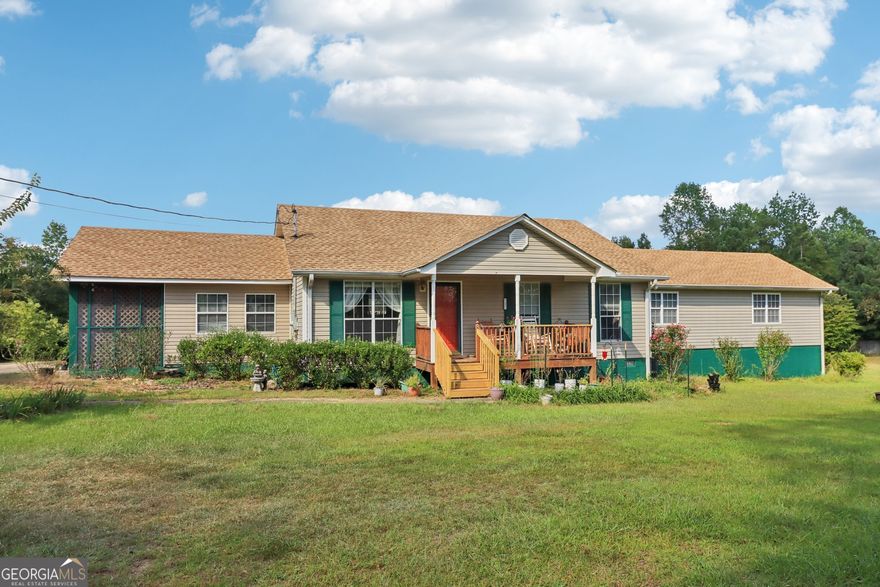 Hard to find a home of this size with over 3 fenced acres and a large Workshop with carport for RV/Camper/Boat Parking! Lovely front porch invites you inside to an over sized great room, dining area, open kitchen with pantry, massive primary bedroom with sitting area and private ensuite bath and walk in closet.  Secondary bedrooms are spacious with plenty of natural light and storage space. Secondary bath features a walk in tub that is just amazing. Possibility of having a 4th bedroom as well. Step on the brand new back deck for hours of taking in the peace and quiet.  Workshop is 44x32 with 16x44 enclosed with 2 roll up doors and an attached carport for parking all your toys.