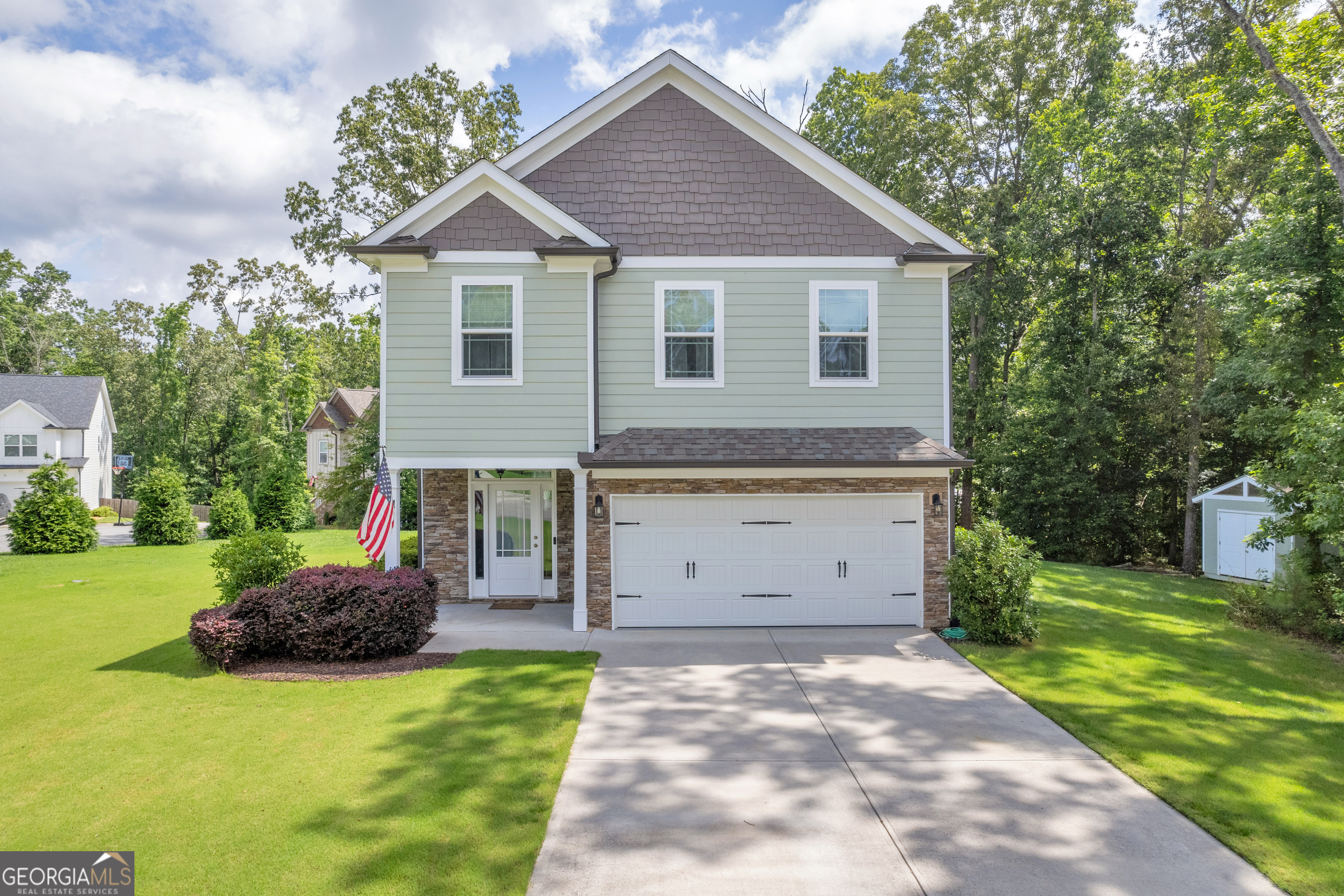 Immaculate Corner Lot Home on Over Half an Acre - Just 5 Years Young! This beautifully maintained 3 bed, 2.5 bath home sits on a spacious .57-acre corner lot positioned between two cul-de-sacs, providing exceptional privacy and one of the largest lawns in the neighborhood. Inside, you'll find an open-concept layout with hardwood floors, a modern kitchen featuring granite countertops, stainless steel appliances, and a large island. Upstairs offers 3 spacious bedrooms, including an oversized primary suite with tray ceilings, his-and-her walk-in closets, dual vanities, a soaking tub with wooded views, and a spa-like walk-in shower, designed with floor-to-ceiling oversized tile, and a built-in bench for added comfort.Outside, enjoy a private, wooded backyard, outdoor shed, and manicured landscaping. Updated lighting throughout. Move-in ready with curb appeal, space, and privacy!