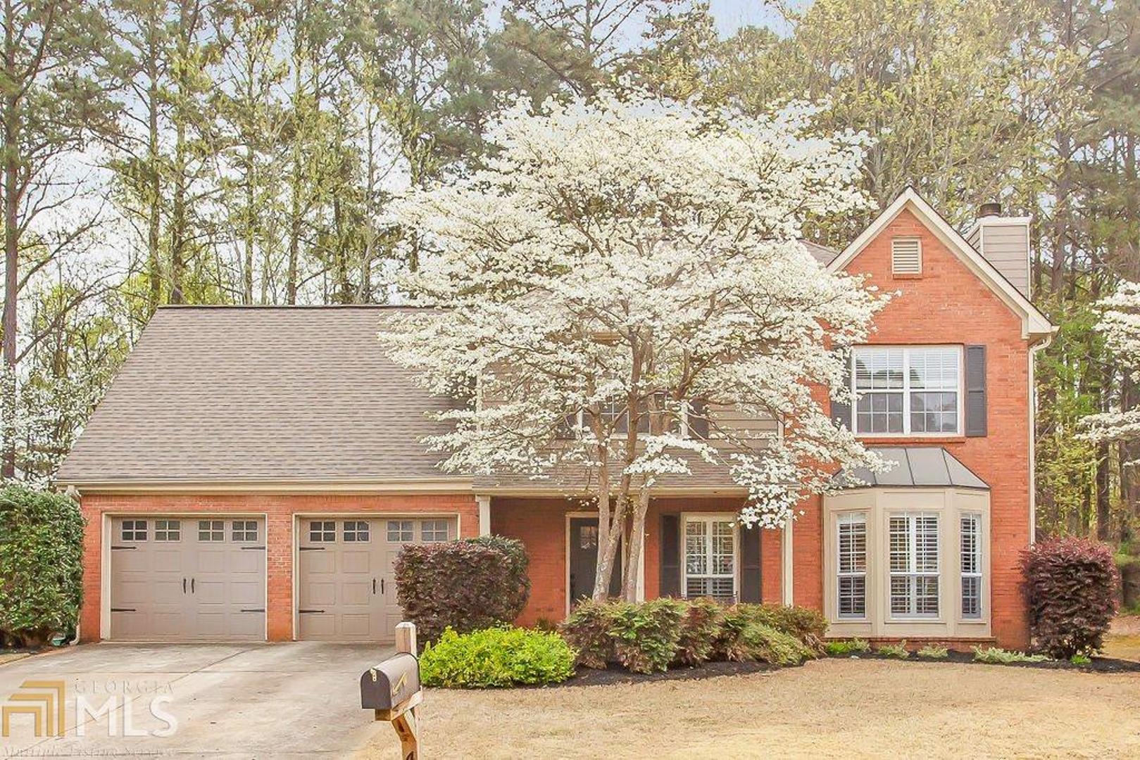 Move in ready, gorgeous, and meticulously maintained! This beautiful family home in the heart of Acworth offers hardwood floors, an updated kitchen with granite countertops and so many more upgrades! The kitchen features a farmhouse sink, a large butcher block top island, and stainless appliances. You'll enjoy custom plantation shutters, a remodeled, custom laundry room, and new carpeting upstairs! Privacy awaits in your fenced backyard but you're moments from everything with easy access to I-75, the new express lane, Hwy 92 and Hwy 41.