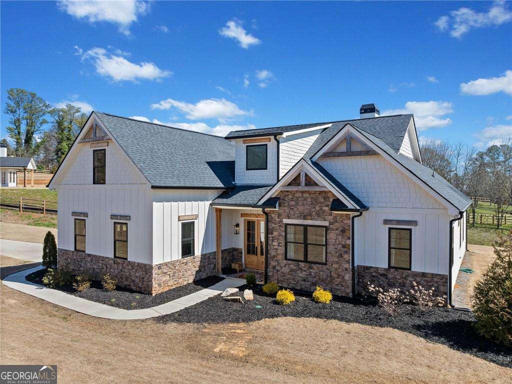 We offer you a private, less than 2 years new gated estate. This custom-built home was hand crafted w/designer details you dream of. Starting w/a gourmet kitchen built with the chef in mind. Ungraded cabinets, solid surface counters, oversized island opens to the great room. Wood & tile flooring, natural colors on walls, designer hardware & lighting with sunlit rooms gives this home a warm & welcoming feeling. Outside is your private oasis complete w/outdoor kitchen, gazebo for afternoon tea & picnics. This property is completely fenced in and blesses you with the most beautiful of sunsets GA. has to offer.