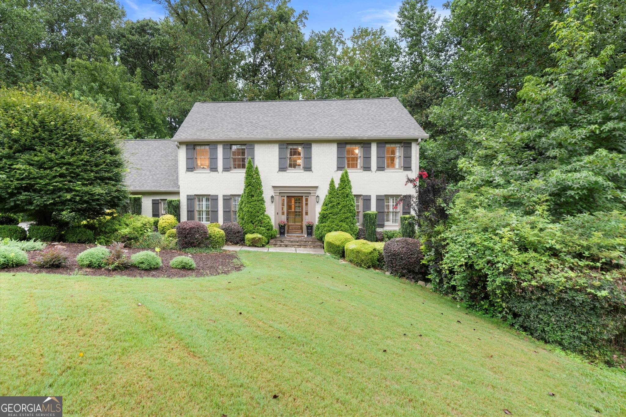 Your wait is OVER! Hurry in to this DREAM HOME in one of East Cobb's most desirable Swim/Tennis communities, served by TOP SCHOOLS! From the charming Cul-de-Sac to the Gorgeous, Brick Traditional Curb Appeal, fantastic Open Flow, Designer Touches and Beautiful Backyard, you will LOVE this home! Enter the welcoming foyer and you are immediately taken by the Elegant, Open Great Room with a sophisticated Wall of Built-in Bookshelves and ENORMOUS space to relax and entertain. Refined finishes greet you at every turn, including custom trim and wainscoting, dental molding, designer wallpaper, built-in cabinetry and more. Love to entertain? Plenty of room for Dinner Parties in the elegant Formal Dining Room with an easy flow to the Updated Kitchen featuring Shaker Cabinets, Granite and Carrerra Marble Tile Backsplash. The Kitchen AND the Great Room open onto the spacious Deck, perfect for Cookouts and Outdoor entertaining. Enjoy your favorite beverage on deck as you watch the games underway in the lush, level, private backyard. So many spaces to relax and unwind! Six Bedrooms include a spacious Primary Suite and an Over-sized Bonus Room/Flex Room, ideal as an upstairs Rec Room, Office or more. The Full Finished Basement offers a large, open Rec Area with room to binge watch TV, Work Out or just hangout. And the private bedroom makes an ideal Teen or Guest Suite. This dream home is located in the heart of East Cobb, near top destination spots; Shopping, Restaurants, The Avenue, Historic Roswell, Sandy Springs and miles of glorious Nature Trails in the Chattahoochee Preserve. Nestled beside Mount Bethel Elementary School, Princeton Lakes is known for friendly neighbors and fantastic amenities, including a clubhouse, playground, pool, tennis courts, beautiful Lake and fishing spots! Served by Mount Bethel ES, Dickerson MS, and Walton HS - Top Ranked Schools recognized for excellence. A RARE opportunity to have the BEST that East Cobb has to offer! Don't miss it!