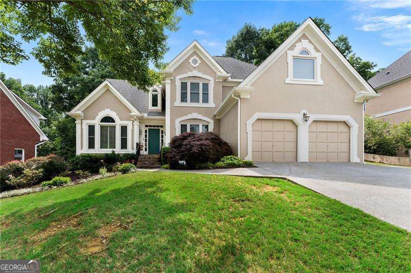 Welcome to this Spacious Multigenerational Home nestled in the sought after Brookstone Country Club community close to Parks, Bike/Hiking Trails, Shopping, Dining, and Sought after schools. This home offers a blend of space and functionality, perfectly situated in the heart of West Cobb's preferred area. The home features a 2-story foyer with hardwood floors in the formal dining, formal living/office and leading to the family room with a stone fireplace, open to a sunny breakfast room and kitchen with stainless appliances. The primary suite is located on the main level, ideal for easy living, and features a walk-in closet while the primary bath features a double vanity and separate tub and shower. Upstairs you will find a loft with three secondary bedrooms that are generously sized and carpeted with walk in closets. Venture downstairs to the fully finished basement that is a true highlight, featuring a second kitchen, generous living room, media room, bonus room, bedroom, and full bathroom-making it perfect for extended family or hosting possibilities. Enjoy outdoor privacy on the oversized deck and fully fenced backyard, ideal for entertaining or relaxing outdoors. With it's versatile layout, superb location, and community amenities featuring a Country Club, Golf, and Swim/Tennis options, this home truly has it all!