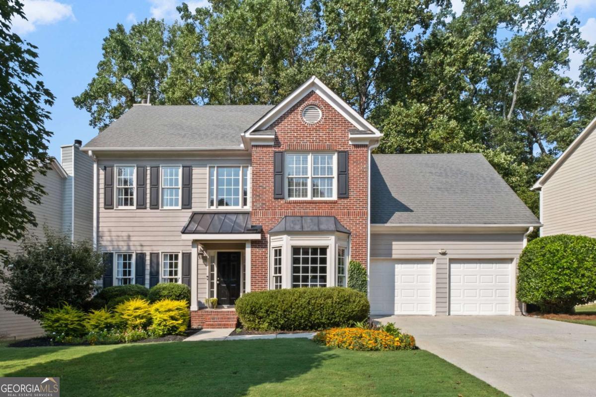Welcome to this beautifully maintained and updated home tucked away in one of Smyrna's most sought-after neighborhoods in the desirable King Springs school zone. From the moment you step inside, you'll be greeted by gleaming hardwood floors, an open and airy floor plan, and stylish updates that make this home move-in ready. The main level is designed for effortless living and entertaining with a spacious living room, a bright dining area, and a welcoming kitchen that flow seamlessly together. An updated powder room adds convenience, while the inviting living room is perfect for cozy evenings or lively gatherings. Upstairs, retreat to the generous primary suite with an updated spa-like bathroom featuring sleek finishes and a calming design. Three additional bedrooms share a fully updated hall bath, providing flexible space for family, guests, or even a home office. Newer carpet adds value to this level. Step outside to your own private oasis: a fabulous new covered back porch overlooking the beautifully landscaped yard with low-maintenance turf. The porch may become your favorite room in the house! Whether you're enjoying morning coffee, watching football in the fall, or unwinding under the stars, this backyard is made for relaxing and entertaining. The owners transformed the space into a lush, family-friendly retreat. Other updates include accent details inside, new windows, fresh siding and more! With a two-car garage, excellent storage, and proximity to The Battery Atlanta, Smyrna Market Village, the Silver Comet Trail, and top schools, this home delivers the perfect balance of comfort, style, and convenience.