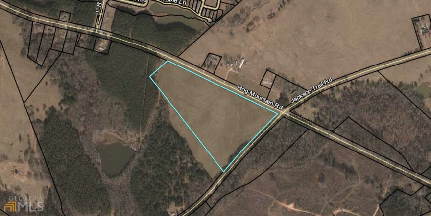 $75,000/AC on Jackson Trail Rd in Winder. Half mile from HWY 316. Currently zoned AG, but owner will agree to apply to rezone to commercial or industrial.   Prime location with 1500 ft of road frontage on HWY 53 - access to gravity sewer line & property will gravity flow. Uses could include retail, convenience store, industrial type uses. Promo video coming soon!