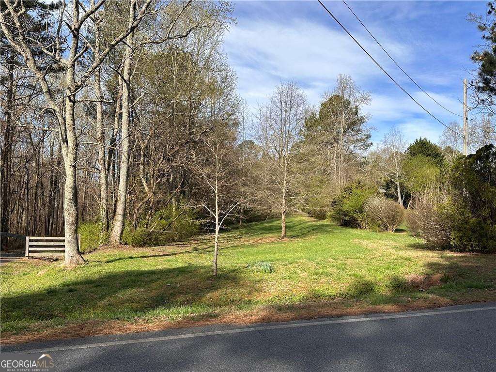 10 ACRES Ready to Build your DREAM HOME in highly desirable location. East High School District. Private 10 acres with cleared lot space to build. Property backs up to Lanierland Park for great access to amenities. Well on property. Water and Sewer available at street.