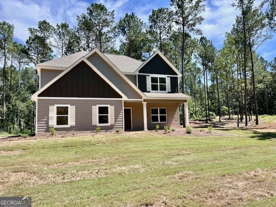 The OVERTON PLAN features entry foyer leading to beautiful Dining Room featuring beautiful detailed trim walls. Open Family Room w/woodburning fireplace featuring brick surround. Kitchen features shaker styled cabinets, granite or quartz counters, designer selected tile backsplash, and Stainless Electric Range/Oven, Dishwasher, and Microhood.  Open concept ideal for entertaining. On the second level you'll find the Large Owner's Suite a luxurious tiled bathroom with double vanity boasting granite or quartz counters, garden tub, and large separate tiled shower.  Three guest rooms w/vaulted ceilings and a shared bathroom.  Hard surface flooring in much of the main level and tiled flooring in bathrooms. Smooth ceilings throughout, pre-wired and braced for fans in guest rooms.  Fiber Cement Siding, Architectural Shingled Roof, and Rear Covered Patio!
