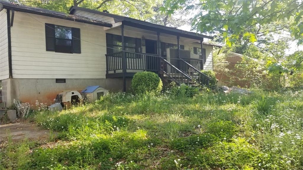 Grove Park Community. Fixer Upper. House had an internal fire. Repairs are needed. Roof and systems are intact. House sits on nearly half-acre lot. Enter property for ally in back of property. Convenient to downtown and 285 Loop. Lots of neighborhood enhancements in progress. Come be a part of the movement. Cash or Conventional only. Property is being sold AS-IS.