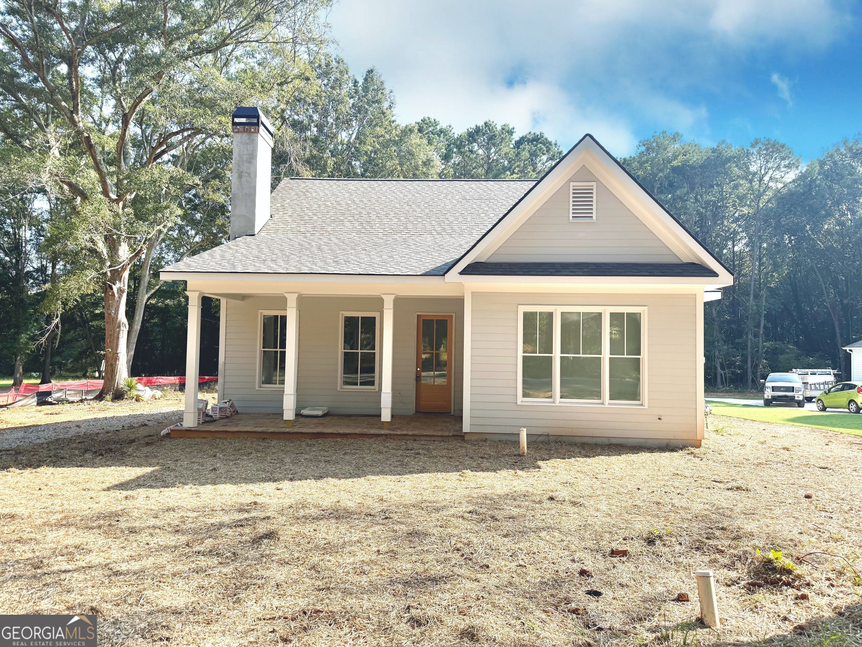 This stunning new construction 4 bedroom/3 bath home combines modern living with small-town charm. Upgrades galore! It's located right beside Lambert Park and minutes to downtown Madison, Morgan County schools, Morgan County Library, Aquatic Center, great restaurants, and shopping. Step inside to an open floor plan with two spacious bedrooms and two full bathrooms on the main level, perfect for easy, everyday living. Upstairs, you'll find two additional bedrooms and a full bathroom, ideal for guests or family. The secondary bedroom on the main level can be used as a home office or study. Enjoy relaxing mornings or evenings on the inviting front porch or the peaceful rear porch. A detached 2-car garage provides ample parking and storage. Don't miss your opportunity to own a brand new home in one of Georgia's most charming historic towns!**Agents, please use the Contract Package found in the DocBox for all offers.**