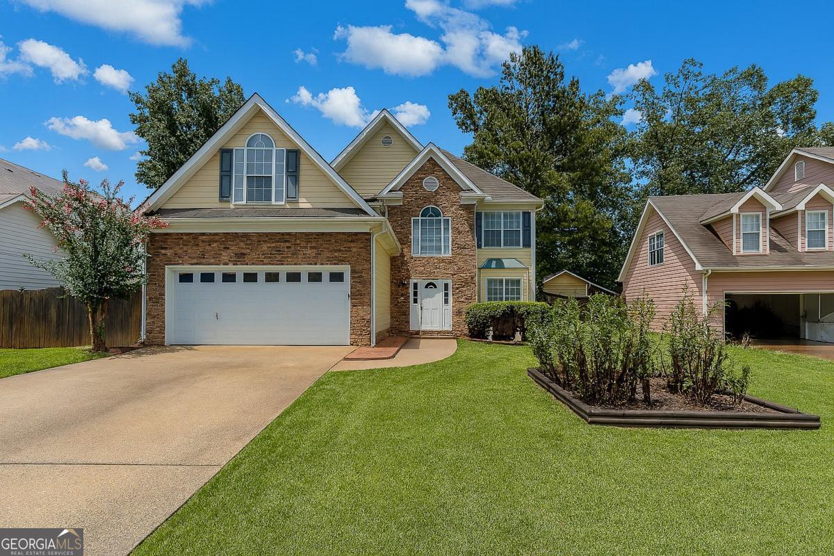 Welcome to 2812 Oak Vista Way, an exceptional opportunity in the desirable Winnsong Chase community of Gwinnett County. Priced below market value and located in a no-HOA neighborhood, this well-maintained home delivers immediate value and long-term upside for the right buyer. Significant updates have been completed in recent years, including a fully renovated primary bathroom featuring a floating tub, seamless glass shower, and wood-look tile floors. The secondary bathroom has also been upgraded with a dual vanity, quartz countertops, and modern fixtures. New flooring has been installed throughout the home. The HVAC system was most recently serviced in July 2025, the main water service line was replaced in 2021, and the roof is approximately eight years old.The home is conveniently located near major shopping centers, restaurants, and commuter routes. Zoned for J.A. Alford Elementary, Richards Middle, and Discovery High School, the location offers easy access to schools without the burden of HOA restrictions. Homes of this caliber, with extensive improvements and a competitive price point, are rare in this market. Multiple offers are expected. Submit your strongest offer early to avoid missing out on this unique opportunity.