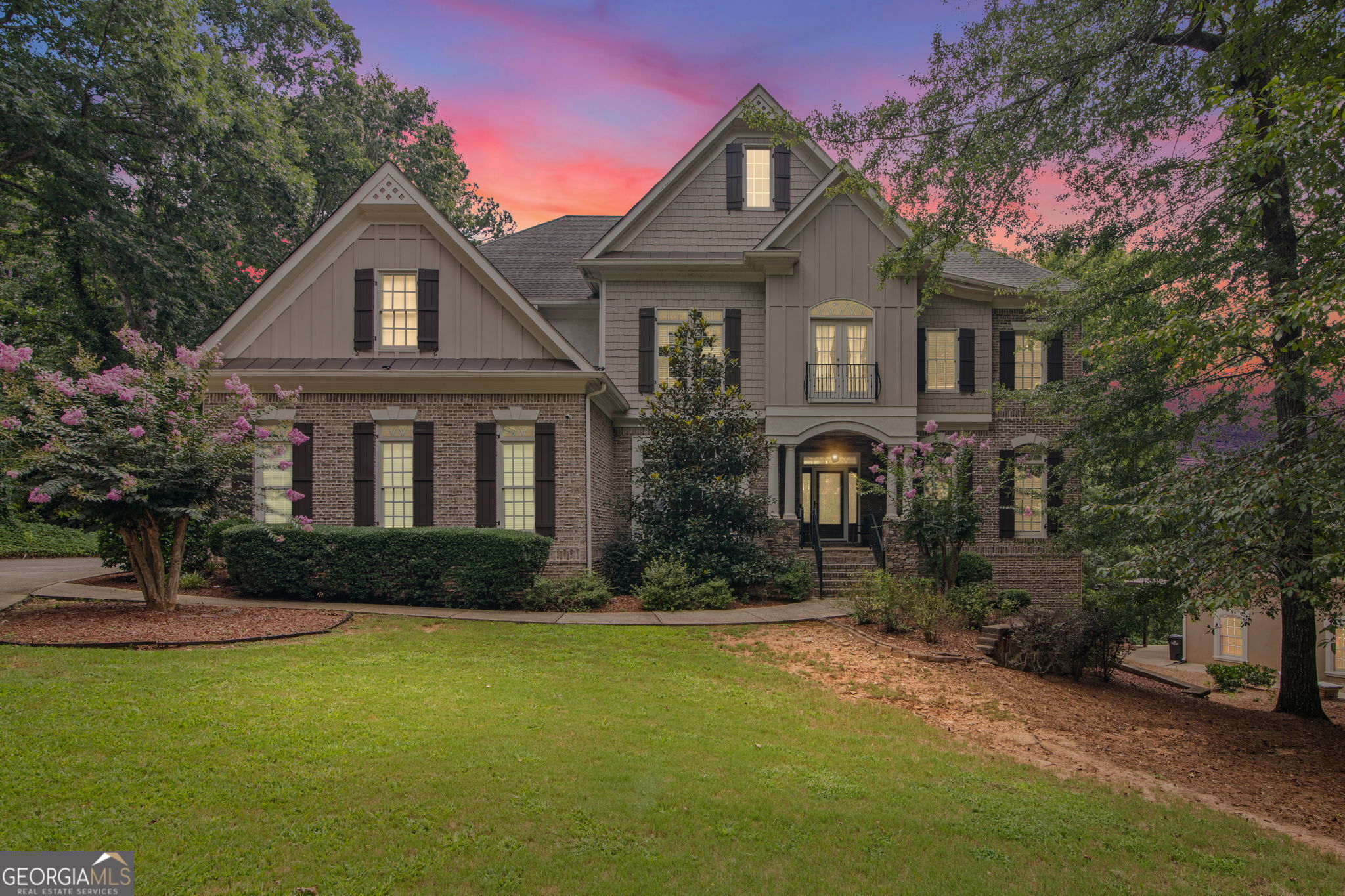 Stately executive home with resort-style backyard! Welcome to this stunning 6-bedroom, 6.5-bathroom custom estate home nestled in the prestigious Chapel Hills Golf and Country Club community. With timeless brick architecture and elegant design throughout, this home offers nearly 7,000 square feet of luxurious living space-perfect for multigenerational living or entertaining in style. Step inside the grand two-story foyer, flanked by a formal dining room and private office, both featuring tray ceilings and double French doors. The breathtaking two-story great room boasts a coffered ceiling, a cozy fireplace, and walls of windows that flood the space with natural light. Two sets of French doors lead to the expansive multi-level deck overlooking your private outdoor paradise. The chef's kitchen is a showstopper, with granite countertops, a center island cooktop, stainless steel appliances including double ovens and a wine fridge and a walk-in pantry. An inviting keeping room features a stone fireplace, built-in bookcases, and a breakfast area for everyday dining. A butler's pantry connects seamlessly to the dining room for effortless entertaining. Upstairs, the primary suite is a true sanctuary, complete with a sitting room featuring a fireplace and bookcases, a private screened porch, and a spa-like ensuite that includes a whirlpool tub, a double vanity with a makeup table, a dual-head tiled shower, and an oversized walk-in closet. Two additional bedrooms have tray ceilings and share a Jack-and-Jill bath. The third bedroom has a vaulted ceiling and a private ensuite bathroom. The finished terrace level is a dream for guests or in-laws, featuring a separate entrance, a living room with a fireplace and surround sound, a kitchenette, a bedroom with an ensuite bath, a game room, a second full bathroom, and a media room. Step into your resort-style backyard, complete with a heated saltwater gunite pool, grotto waterfall, hot tub, fire pit, and multiple screened and open-air porches for year-round enjoyment. Additional features include a whole-home vacuum, a three-car garage, and access to Chapel Hills' world-class amenities, including golf, tennis, a pool, and a clubhouse. This is more than a home-it's a way of life!