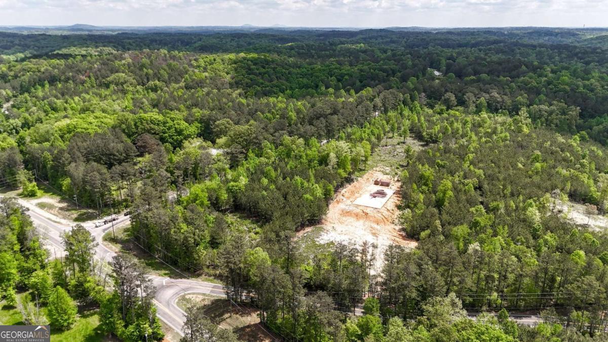 Prime Land Opportunity with Existing Foundation Co High-Growth Area! Seize this rare opportunity to develop in a fast-growing, high-visibility location with easy access to major highways. This prime parcel is ideally positioned, surrounded by well-established businesses and thriving residential communities, ensuring excellent exposure and consistent traffic. The property features a poured foundation (60' x 120'), ready to support your next developmentCosaving you valuable time and startup costs. In addition, there is ample space for up to 100 parking spaces, making it ideal for businesses that rely on accessibility and convenience. Don't miss out on this ready-to-build opportunity in one of the region's most dynamic and expanding corridors.