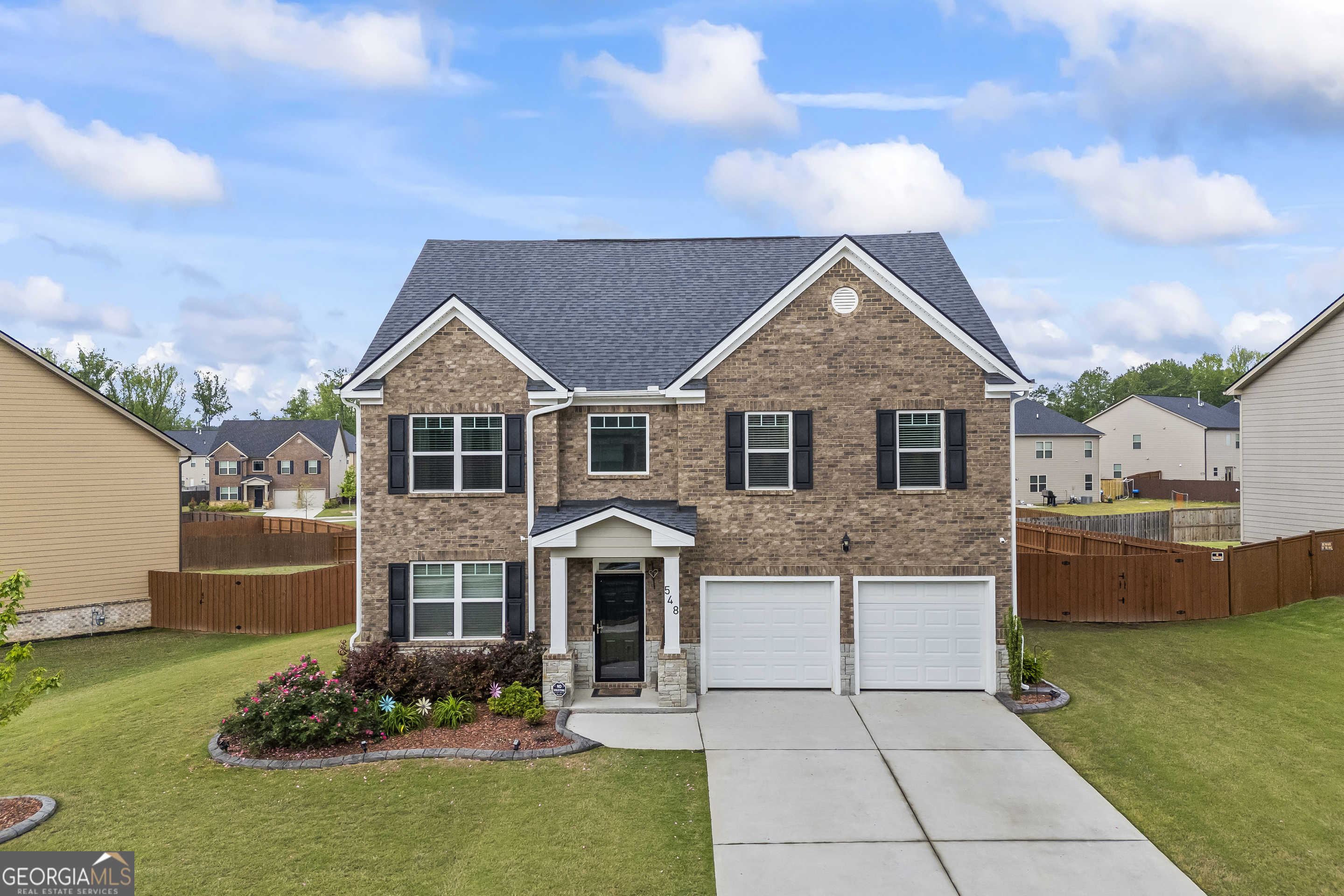 Welcome to 548 Azalea Bloom Drive-where charm meets functionality! This stunning 4-bedroom, 2.5-bath home is located in the desirable Independence neighborhood of Grayson. Built with modern living in mind, it features an open-concept layout, granite countertops, stainless steel appliances, and a spacious guest suite on the main level. The upstairs offers a luxurious primary suite with a spa-like bathroom and walk-in closet. Enjoy the oversized backyard-perfect for entertaining or relaxing. Community amenities include a pool, playground, clubhouse, and walking trails. Zoned for nice schools!