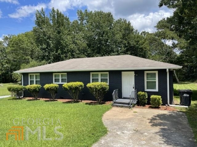 Welcome home! Great location! Close to schools! 2 bed, 1 full bath, W/D hookups, large rooms, beautifully grassed lot, original hardwood flooring, brick exterior, must see!