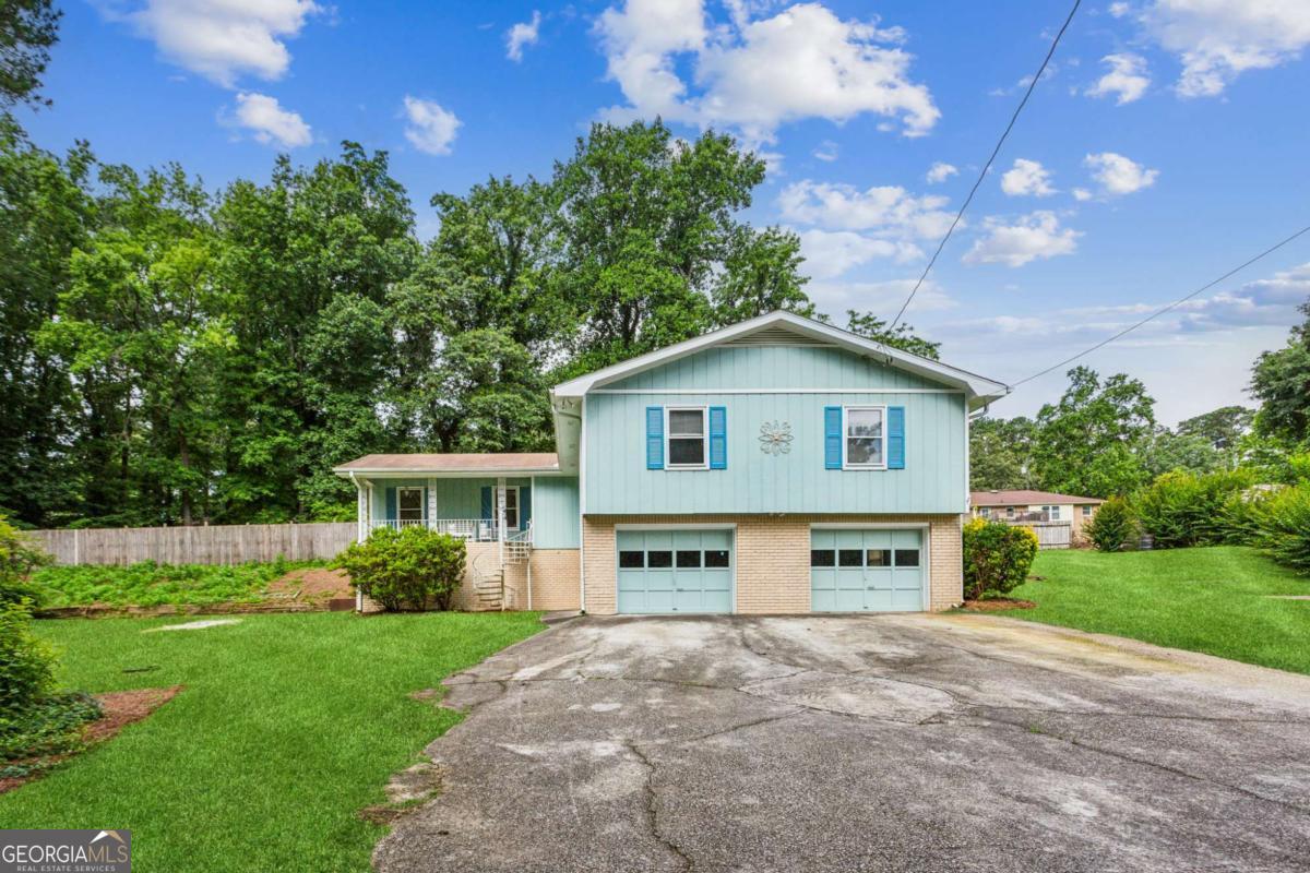 Welcome to 6889 Kingsboro Drive - a tucked away ranch style home at the end of a cul-de-sac in a quiet Lithia Springs neighborhood. This 3-bedroom, 2-bathroom home offers a wonderful balance of comfort and privacy - perfectly suited for those seeking quiet, single-level living. Upon arrival, you'll appreciate the inviting curb appeal and the tranquility that comes with being nestled on a low-traffic street. Inside, you're greeted by a spacious, living room with a cozy fireplace - the perfect gathering space for relaxing evenings or hosting guests. The adjacent breakfast area and kitchen offer plenty of space for entertaining, that flows seamlessly to the backyard. The primary suite includes an en-suite bath and ample closet space, while two additional bedrooms and a full hall bath provide flexibility for family, guests, or a home office. Step outside and enjoy your own private backyard oasis, complete with a cozy fire pit and a sparkling in-ground pool, all set within a spacious, fenced yard - ideal for sunny afternoons, weekend get-togethers, or quiet mornings with a cup of coffee. Whether you're entertaining a crowd or enjoying a peaceful moment, this outdoor space offers room to truly enjoy. Additional highlights include an attached two car garage, no HOA, and a prime location just minutes from I-20, Sweetwater Creek State Park, schools, shopping, and dining. If you've been searching for a move-in ready HOME, this one checks all the boxes.