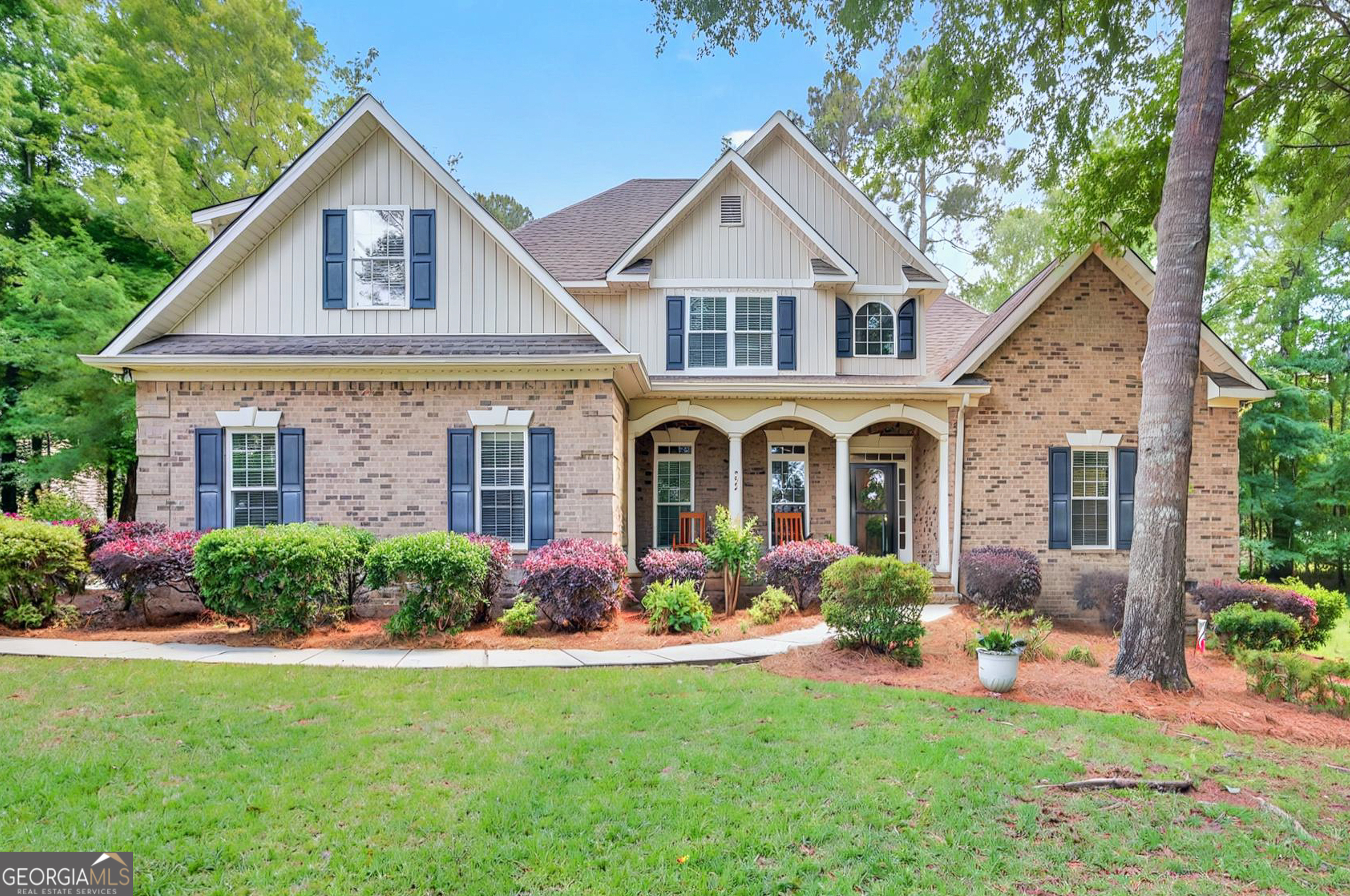 Welcome to this stunning and meticulously maintained 5-bedroom, 3.5 bath home, perfectly designed for comfort, style, and functionality. From the moment you step inside, you'll appreciate the open floor plan that seamlessly connects the spacious living room, elegant dining area, and incredible kitchen-complete with beautiful cabinetry, sleek countertops, and high-quality appliances that will delight any home chef. The main level master suite is a true retreat, featuring a luxurious en-suite bath with soaking tub, separate shower, double vanity and an oversized walk-in closet. Upstairs you'll find additional generously sized bedrooms and well appointed bathrooms, offering space and flexibility for family or guests. Step outside to a private backyard ideal for entertaining, relaxing, or playing or enjoy from your screened porch. Plus there's room for you RV under the included shelter. This home has been lovingly cared for and shines with curb appeal, comfort, and thoughtful upgrades throughout. Don't miss your chance to own this beautiful home that truly has it all! It also has a deeded lake access lot to Lake Sinclair. 1 1/2 hour from Atlanta airport, 40 minutes to Macon, 1 hour 15 minutes to Athens. Close to shopping and downtown Milledgeville.