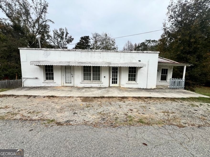 Amazing opportunity for someone seeking a Mix-use property!  Imagine being able to comfortably reside on the property where you run your business. There are two building structures. The building in the back sits on a private quiet lot, with ample space to host guest. The building in the front is spacious with a private office space to the left, as you enter the property.  This is a perfect space for the owner to have and run their business.  There is a massive open space for a business space and patrons to visit.  The back area is private. There is space for an employee break room, and even a separate area additional office space. This building has a powder room and full bathroom.   The basement has a large space for storage.  The basement is a perfect location to store inventory or make us to work on inventory before displaying it for customers.  The basement also has two other areas for storage.  A three-piece bathroom is also available.      The residential home has a living room as you enter the front door.  A barn style door divides the primary bedroom and living room.  A spacious den is to the right of the living room, which opens up to the kitchen with beautiful solid wood cabinetry.  A second bedroom is also in the home and is perfect for guests or another member of the family.  There is also a full bathroom and washer and dryer hookup in the home.  A fenced-in backyard is perfect for a private gathering.   Two additional storage sites are located on the property.  One behind the residential home and one to the side of the commercial building.