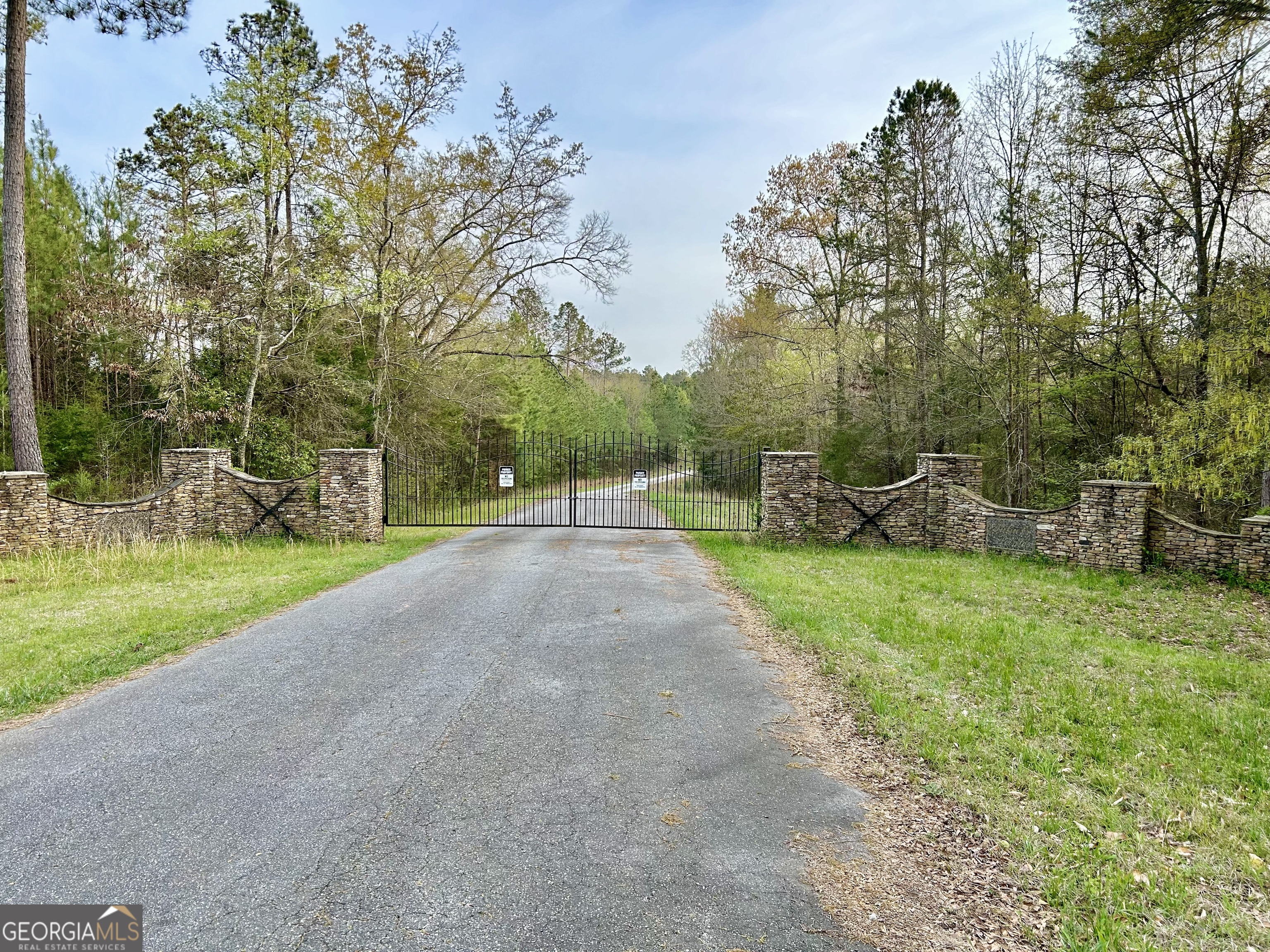 Come check out this hidden gym on Lake Russell. Lakefront property without the lakefront price. This gorgeous property offers spectacular views and privacy all within a Gated Community. Escape city living and enjoy a laid back lifestyle on your own private oasis.