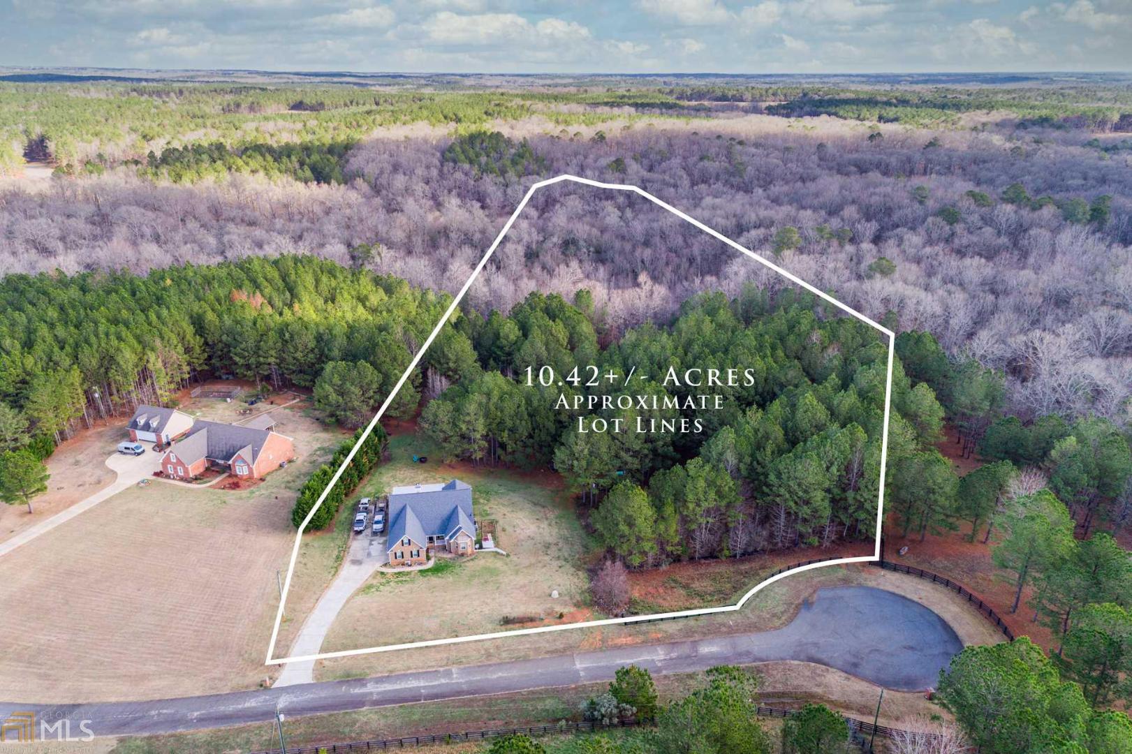 Brick home with acreage! If you've been looking for a spacious home with acreage, your search is over. This 4BR/3BA home is move-in ready and has room for everyone to spread out. The main level hosts the master suite and two additional bedrooms along with a walk out porch off the dining room. Upstairs is a bonus room which could easily be converted into a 5th bedroom. Many custom features have been added including custom tile showers and a stone fireplace. Downstairs is a fully finished basement with a large bedroom and full bath, entertainment area and a large workshop. Opportunities abound outside with the surrounding acreage complete with wildlife flocking to the planted food plots. Located in the back of a quiet neighborhood, this home is a true gem!
