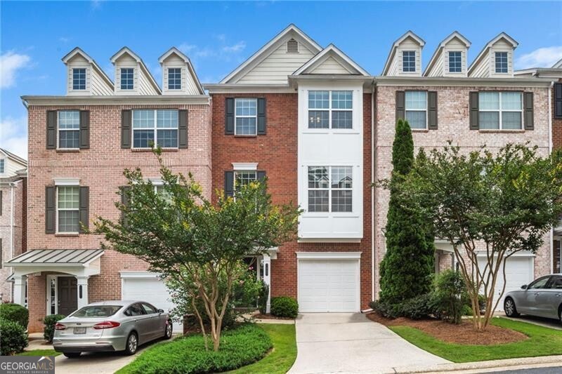 This Beautiful 3 bedrooms and 3.5 bathrooms Townhouse is nestled within the sought-after Gated Cambridge Community. This townhouse combines modern elegance with comfortable living and entertaining spaces. The bright and airy interior features an inviting kitchen highlighted newer stainless-steel appliances, island, granite countertops, tile backsplash, under-cabinet lighting. The charming breakfast area overlooking a private wooded backyard and deck, offering a peaceful retreat. The spacious family room provides the perfect setting for relaxation, complete with a cozy fireplace for chilly evenings. On the upper level, the primary suite impresses with a walk-in closet and a spa-like ensuite featuring double vanity, soaking tub, and a walk-in shower. The secondary bedroom and bath are generously sized, ideal for guests or family. On the lower level, a versatile additional bedroom and bath offer flexibility-perfect for a guest suite, workout space, or a dedicated home office. Step outside to discover a serene, wooded backyard designed for tranquility and easy maintenance. The garage and extended driveway provide ample parking, with convenient visitor spaces nearby. Low-Maintenance Living & Prime Location, this home is designed for effortless upkeep, featuring newer kitchen appliances, HVAC units, roof, deck, and a water heater, all complemented by professional landscaping covered by the HOA. Situated near Morgan Falls Overlook Park, enjoy scenic views, walking trails, picnic pavilions, ball fields, and direct access to the Chattahoochee River for kayaking and paddleboarding. Golf enthusiasts will love the proximity to Steel Canyon Golf Club, which boasts an 18-hole public course, a heated driving range, and expert golf lessons. With premier shopping, dining, and entertainment just minutes away and only 10-15 minutes from Downtown Roswell, Buckhead, and Downtown Atlanta. This townhouse seamlessly combines privacy, convenience, and a vibrant lifestyle. Welcome to your move-in-ready dream home!