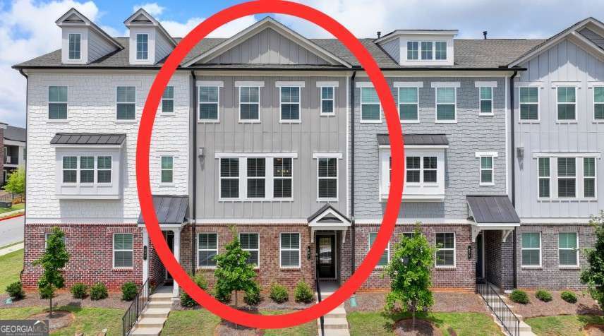 Location, location, location! Discover this beautiful Built in 2022 by Lennar Homes townhouse in the heart of Suwanee, just minutes from I-85 (Exit 111), shopping, and dining. This floor plan offers a spacious, modern design across three levels with an all LVP flooring throughout the home and rear-entry garage. Enjoy an open-concept main level with soaring 10-ft ceilings, abundant natural light, and upscale finishes throughout. The gourmet kitchen features granite countertops, an oversized island, 42" white cabinetry, and stainless-steel appliances. This smart home is equipped with Ring Security System, Ring Doorbell, MyQ Garage Opener, and Honeywell thermostats. Move-in ready and close to everything - this exceptional property won't last long!