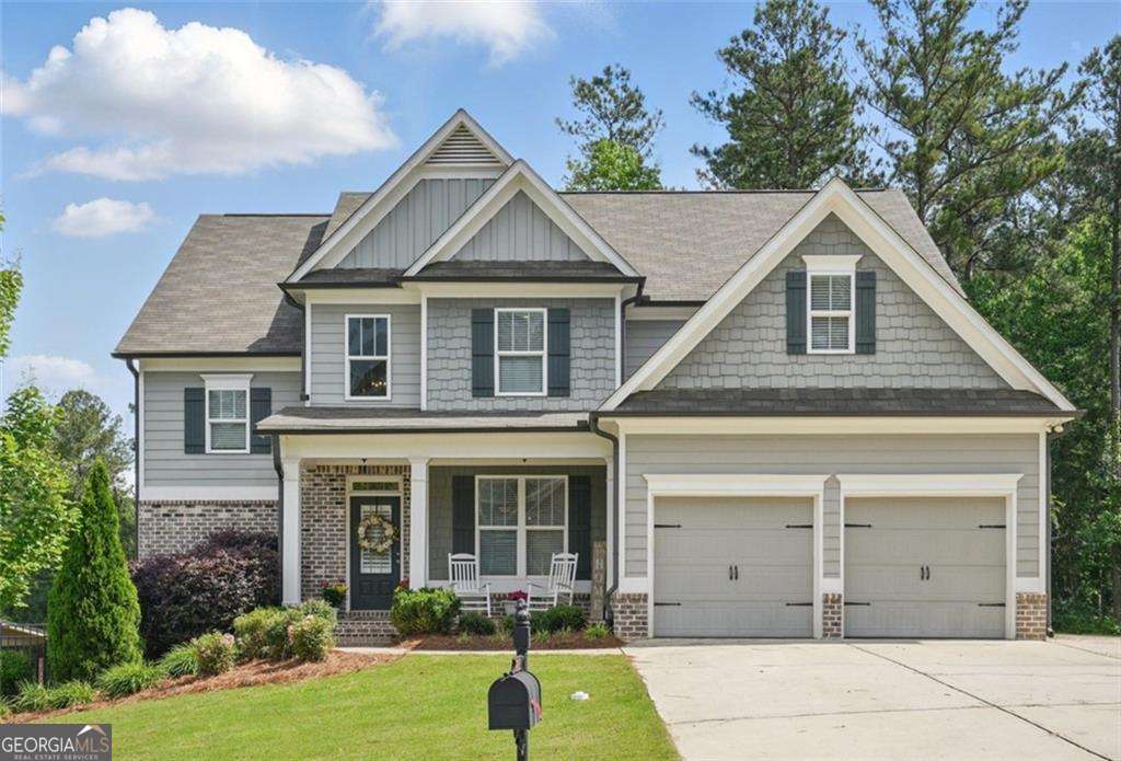 For all intents and purposes, welcome home!! This North Paulding County traditional style home is in search of its next homeowner. Boasting 5 bedrooms, 4 full baths, and sitting on an unfinished, oversized, daylight basement, this home offers room for growth. Enter into the open concept living area overflowing with natural light and neutral tones throughout. Enjoy hosting guests in front of the stone fireplace beneath a coffered ceiling while you prep meals in your kitchen. Have charcuterie trays set up on the oversized island while you chill a bottle of chardonnay in the wine cooler. This kitchen comes complete with a full sized pantry, granite countertops, shaker cabinets, stainless steel appliances, and a separate counter space perfect for a coffee making station or a place to display your favorite bottle of Bourbon. One full bedroom and bathroom are on the main floor, perfect for a home office, playroom, or separate guestroom. Head up the turn style stairs to find a loft space and 4 full bedrooms. A jack and jill bathroom joins 2 of the bedrooms while the final secondary bedroom has its own private bathroom. The primary bedroom offers a tray ceiling, a walk in closet, and an oversized bathroom with dual vanity, a soaking tub, and a standalone shower with dark tiles and a bench. The unfinished basement offers endless possibilities to be finished off or left as-is to build out a home gym, game space, or even just ample storage. Enjoy the sunset on the covered back deck while you enjoy the feel of a cross breeze. Seven Hills subdivision offers resort style amenities like pickleball, tennis, volleyball, and basketball courts, a splash pad, Junior Olympic sized swimming pool, a dog park, clubhouse, playground, a picnic pavilion, and hiking and biking trails throughout the community. Book your tour today!